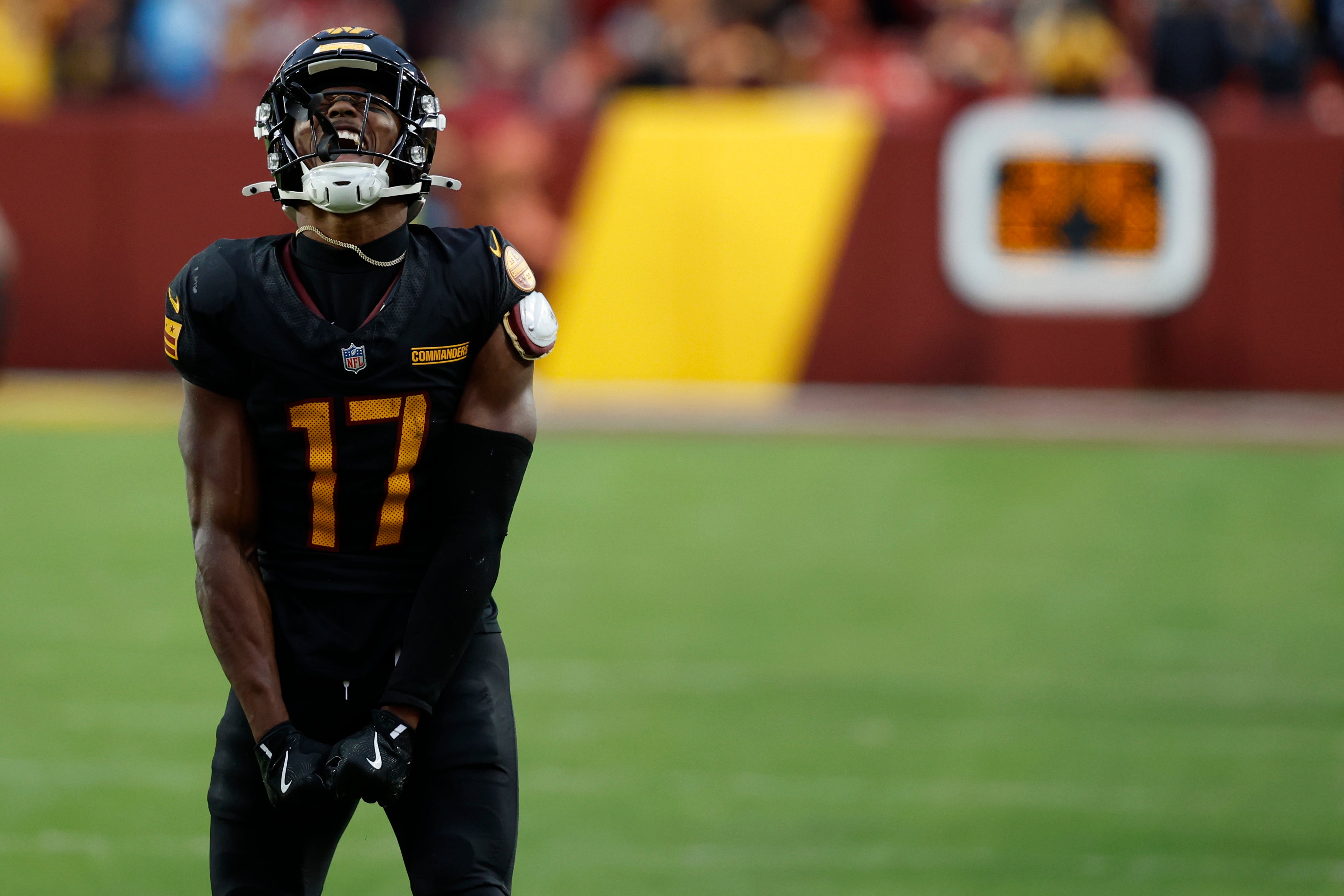 Dec 1, 2024; Landover, Maryland, USA; Washington Commanders wide receiver Terry McLaurin (17) reacts after making a catch against the Tennessee Titans during the fourth quarter at Northwest Stadium.