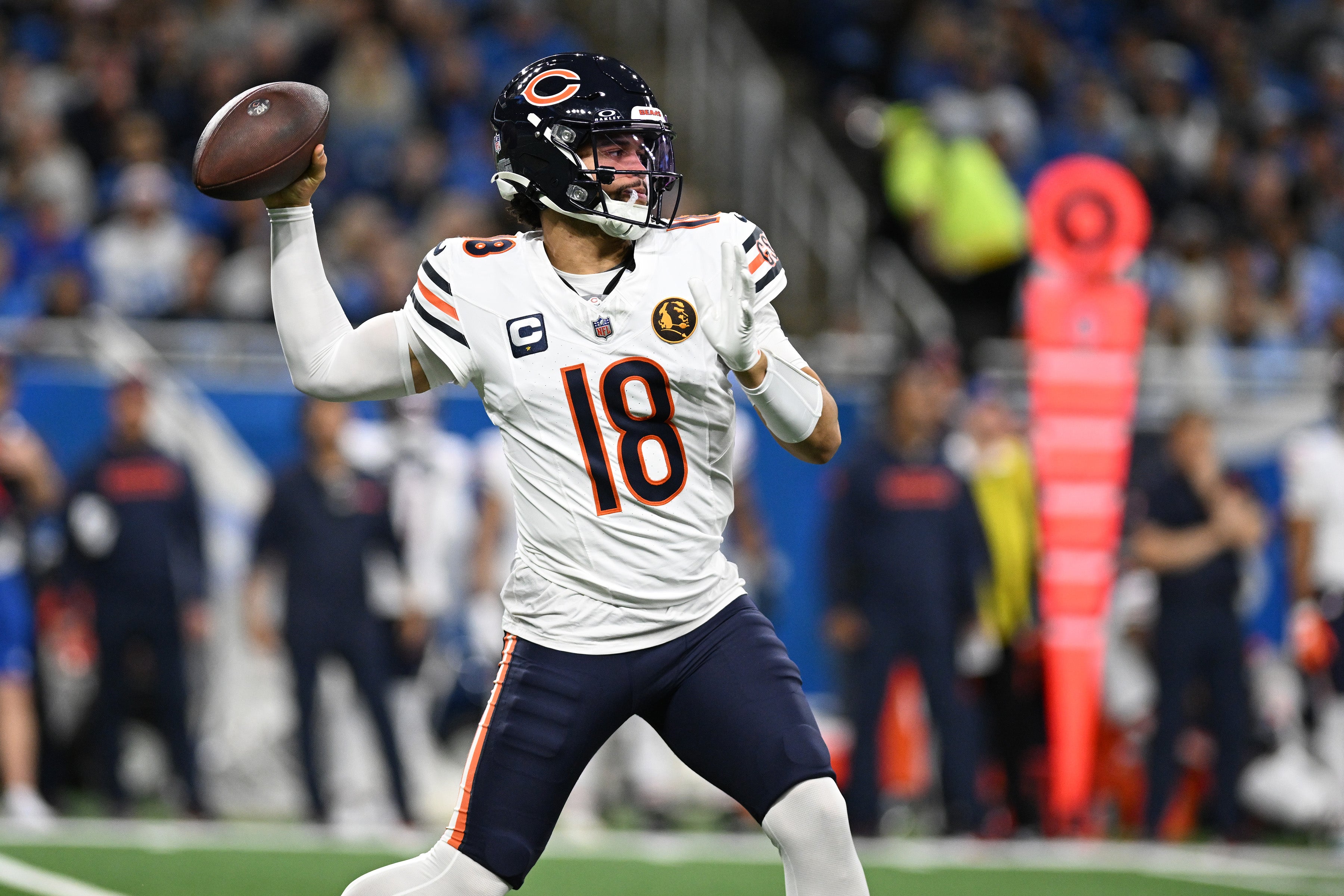 Nov 28, 2024; Detroit, Michigan, USA; Chicago Bears quarterback Caleb Williams (18) throws a pass against the Detroit Lions in the second quarter at Ford Field.