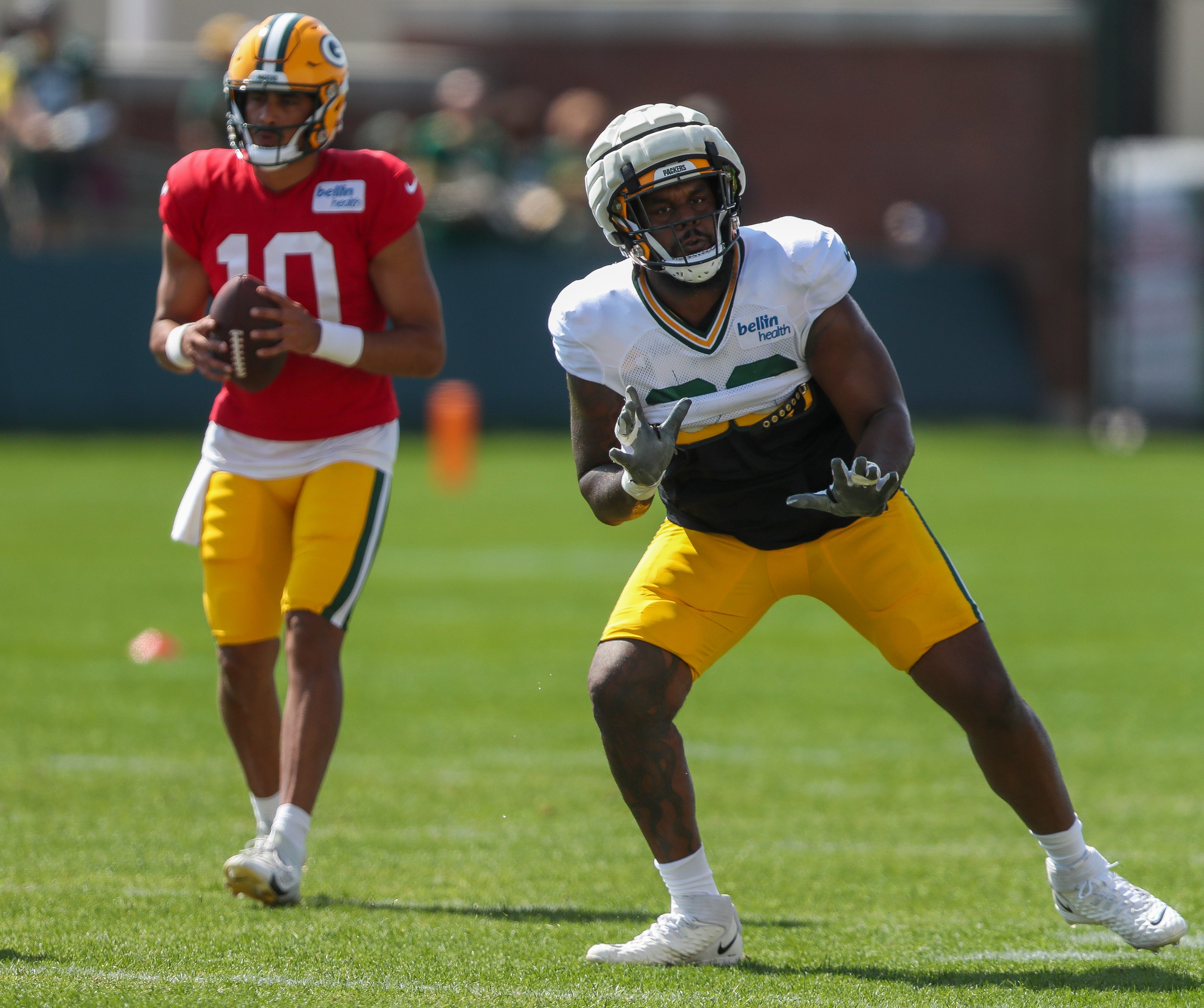 Green Bay Packers offensive lineman Rasheed Walker (63) runs through a drill during practice on Wednesday, August 14, 2024, at Ray Nitschke Field in Ashwaubenon, Wis. 