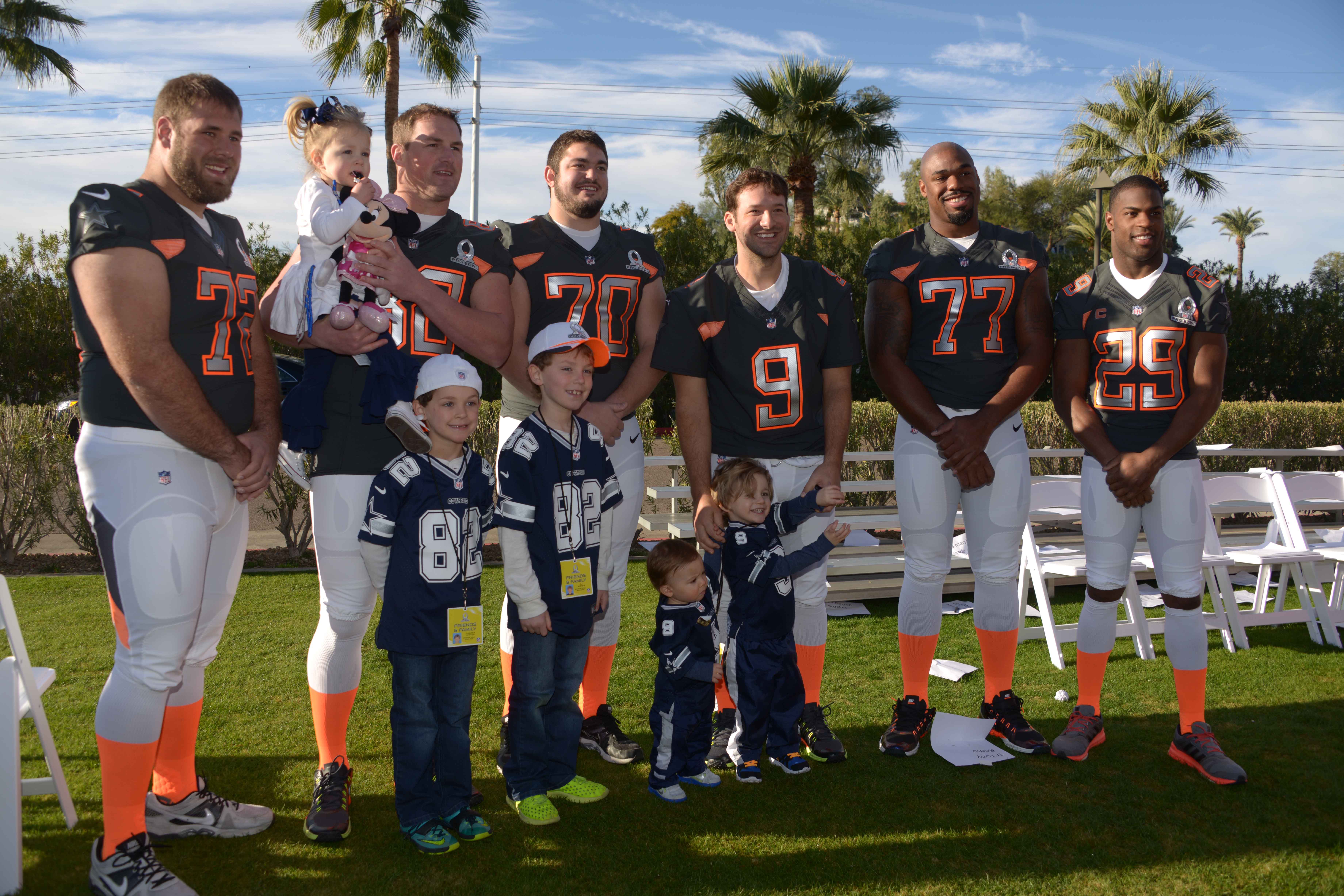 Jan 23, 2015; Phoenix, AZ, USA; Dallas Cowboys players Travis Frederick (72), Jason Witten (82), Zack Maritn (70), Tony Romo (9), Tyron Smith (77) and DeMarco Murray (29) pose with the children of Witten (Landry Witten and Cooper Witten and C.J. Witten) and Romo (Rivers Romo and Hawkins Romo) during team photos for the 2015 Pro Bowl at The Arizona Biltmore. Mandatory Credit: Kirby Lee-Imagn Images