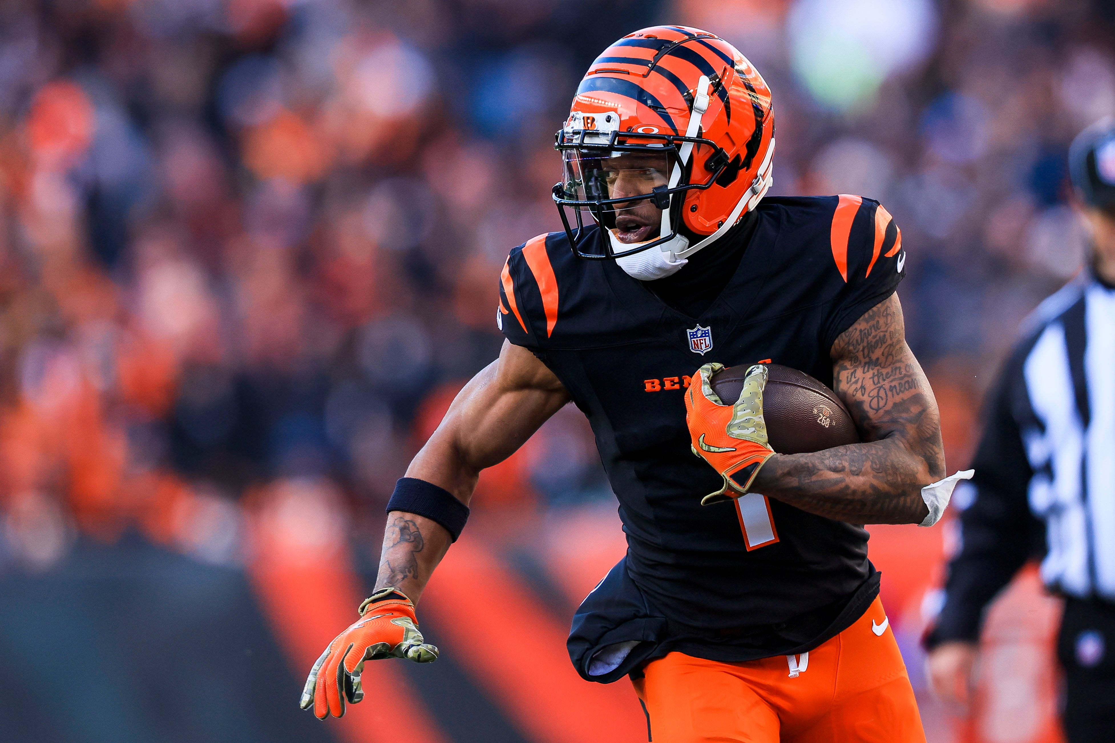 Dec 22, 2024; Cincinnati, Ohio, USA; Cincinnati Bengals wide receiver Ja'Marr Chase (1) runs with the ball against the Cleveland Browns in the second half at Paycor Stadium.