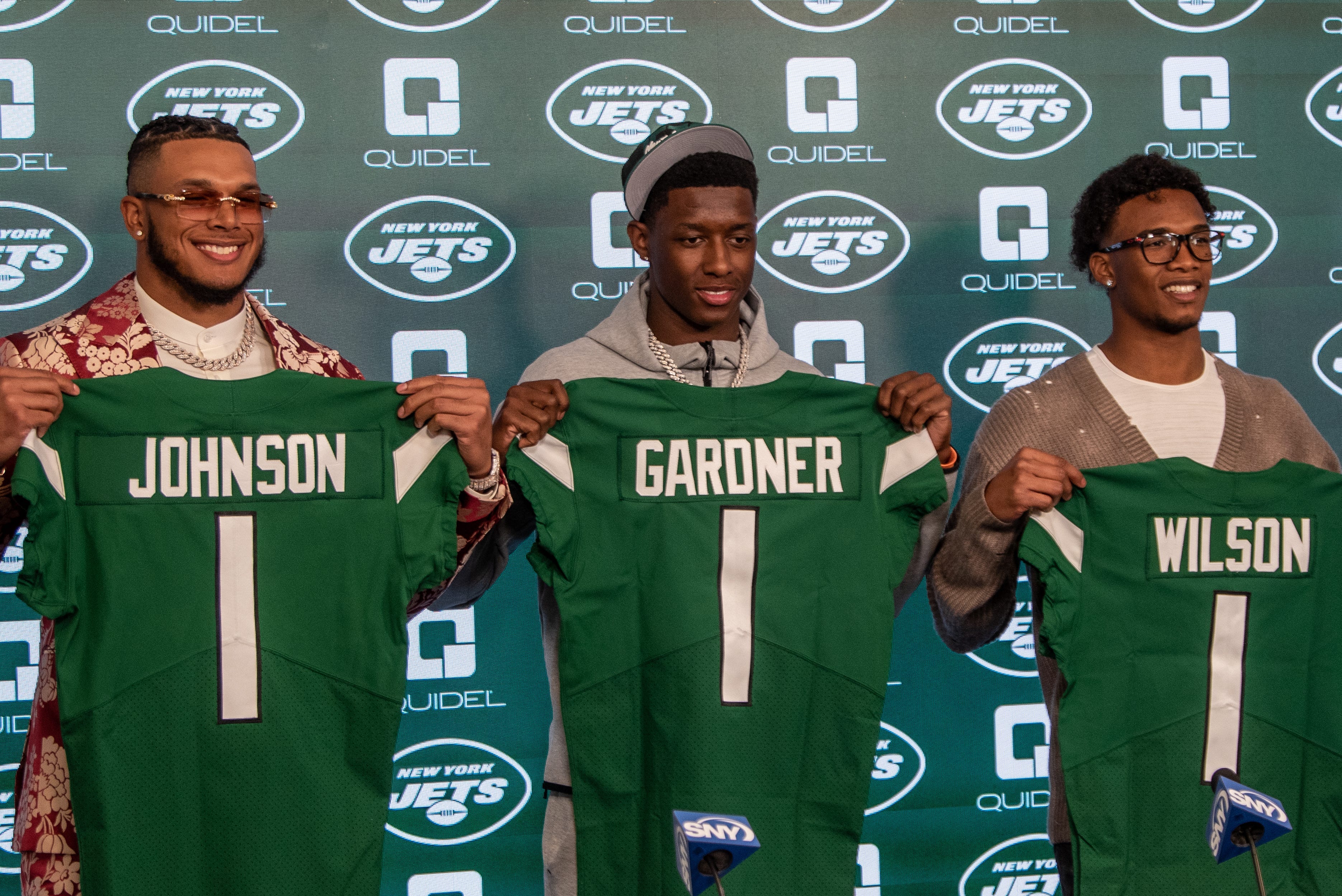 The New York Jets' first-round picks Jermaine Johnson, Ahmad \"Sauce\" Gardner and Garrett Wilson are introduced at a press conference.