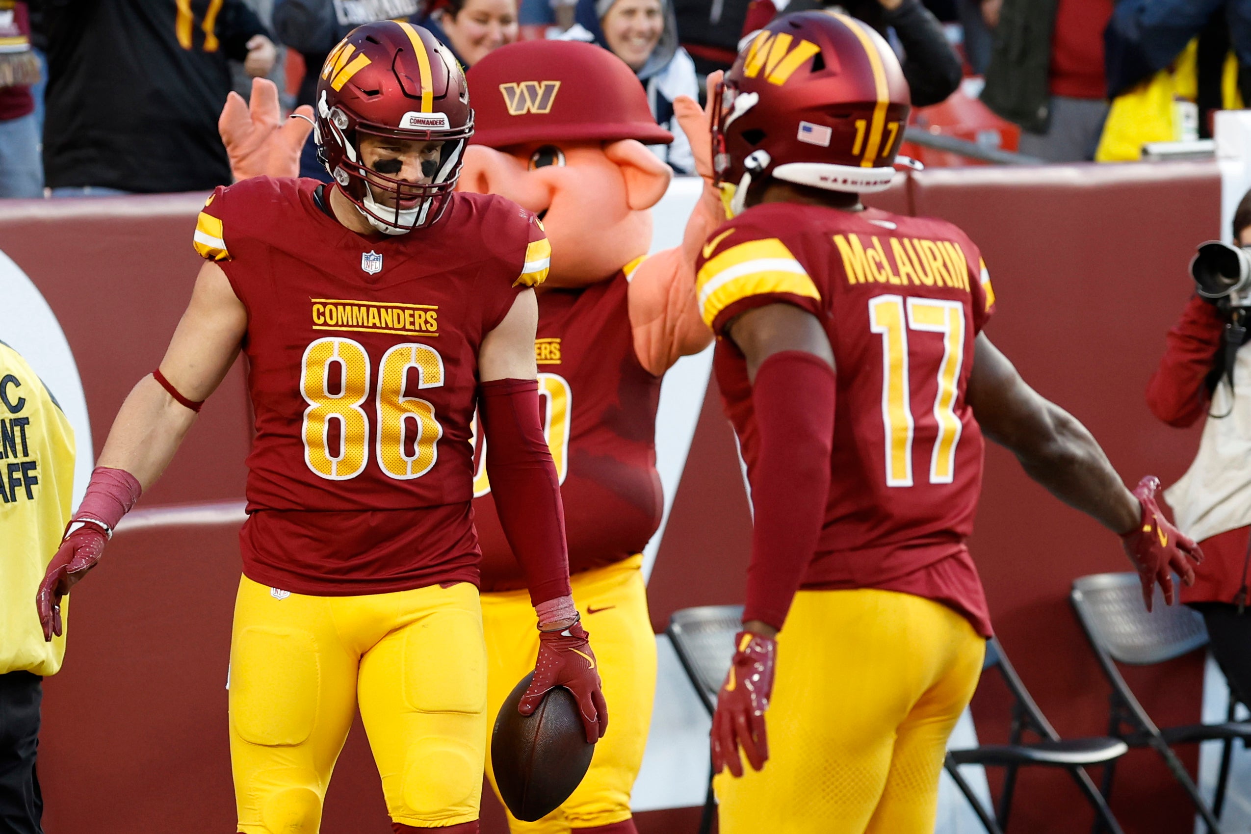 Nov 24, 2024; Landover, Maryland, USA; Washington Commanders tight end Zach Ertz (86) celebrates with Commanders wide receiver Terry McLaurin (17) after catching a touchdown pass against the Dallas Cowboys at Northwest Stadium.