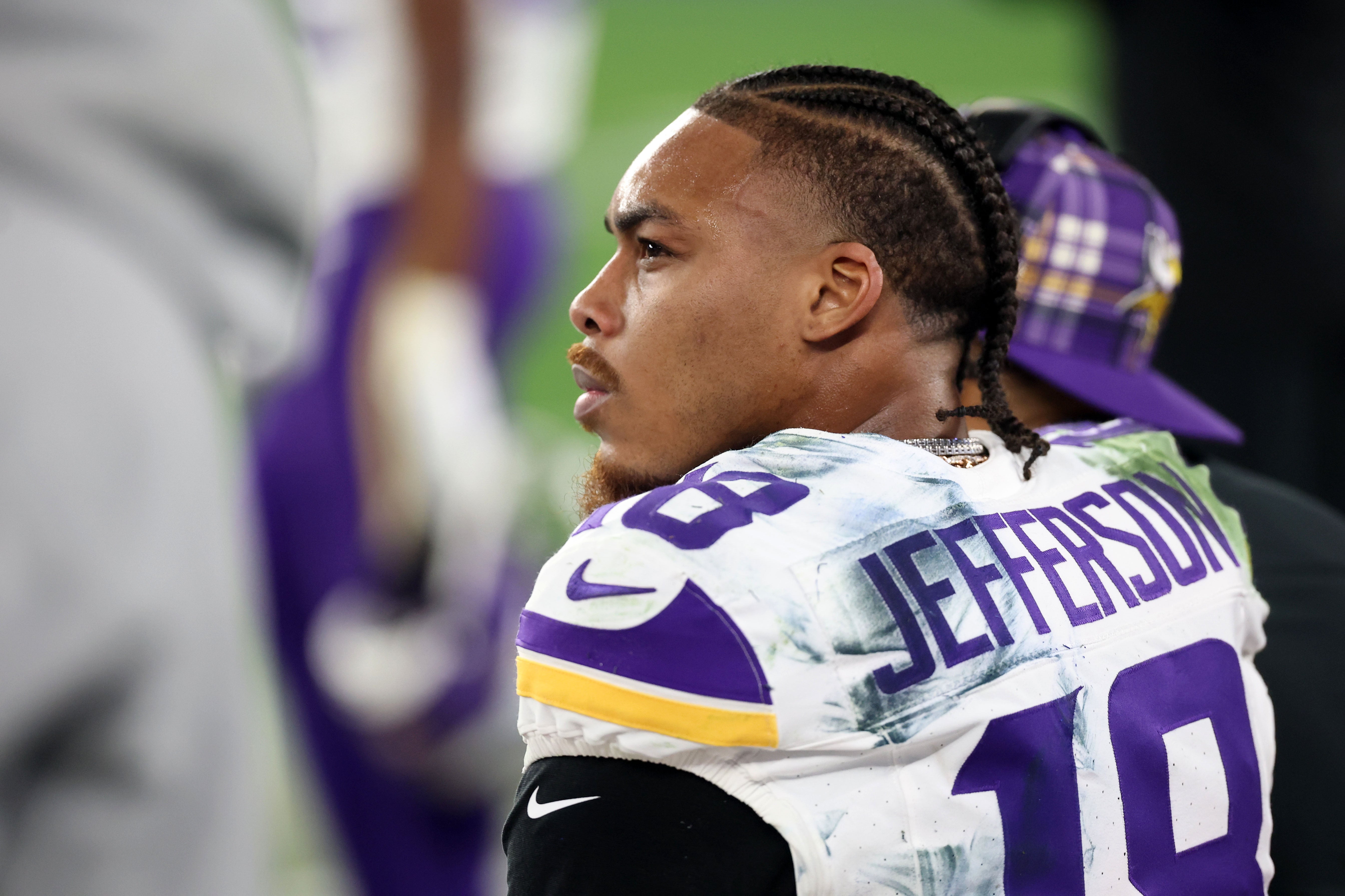 Jan 13, 2025; Glendale, AZ, USA; Minnesota Vikings wide receiver Justin Jefferson (18) reacts on the bench against the Los Angeles Rams during the second half in an NFC wild card game at State Farm Stadium.