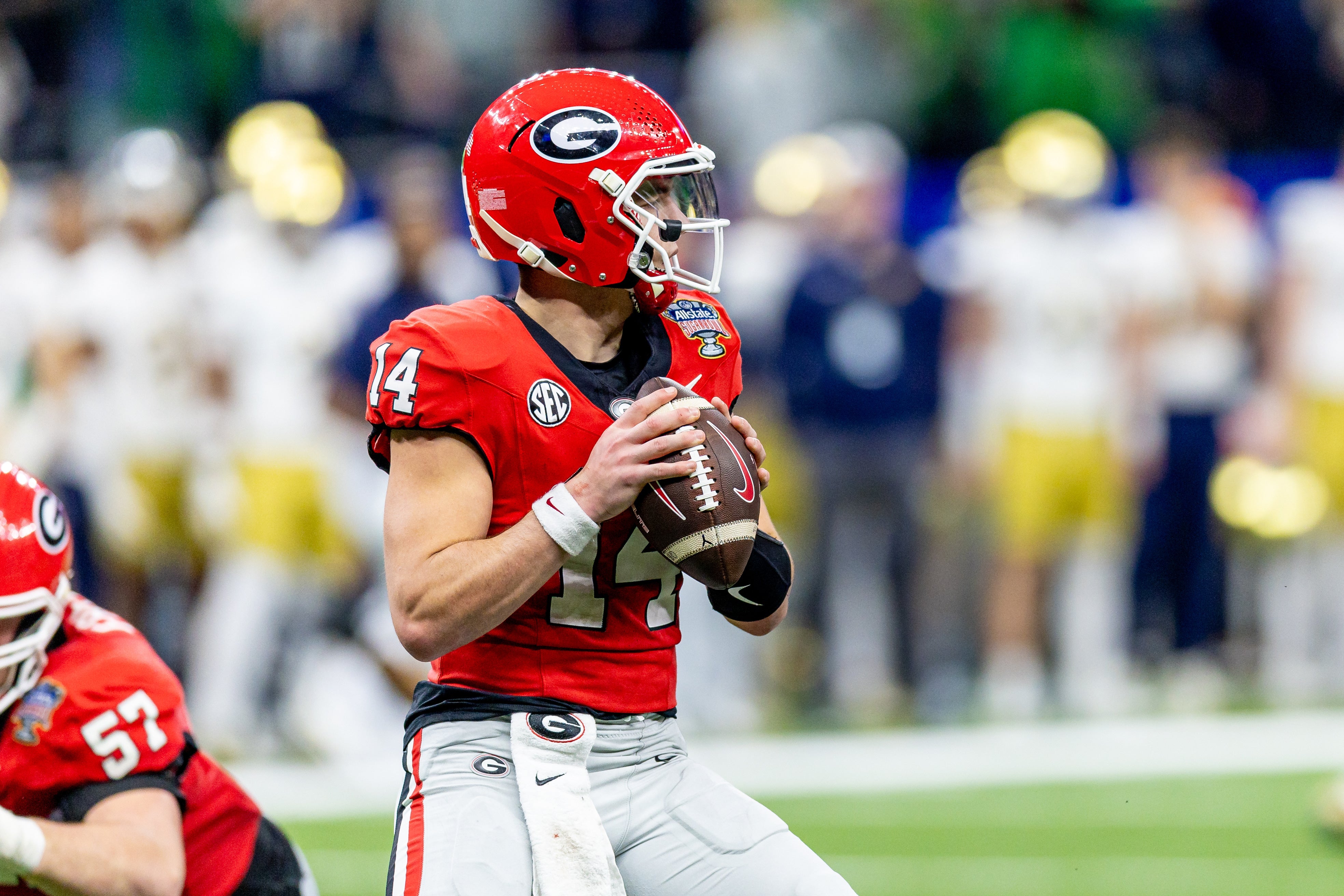 Georgia Bulldogs quarterback Gunner Stockton (14) drops back to pass against the Notre Dame Fighting Irish during the first half at Caesars Superdome.