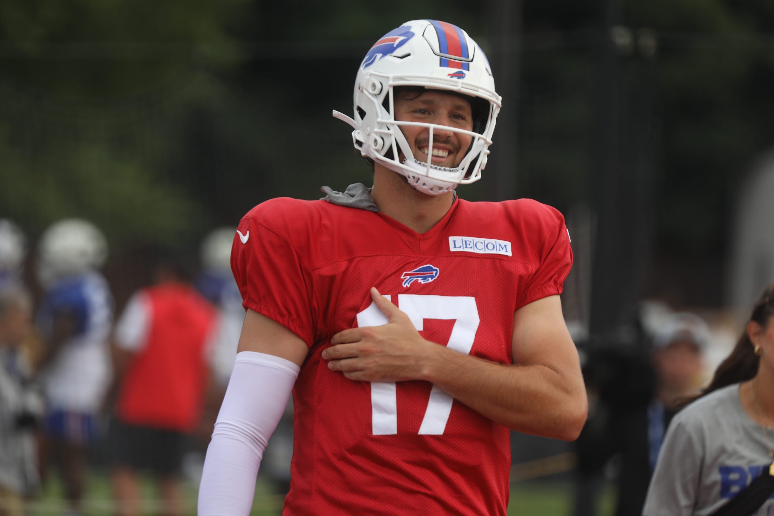Bills Josh Allen laughs as he jokes with teammates as he moves to another practice field with other offensive players during Bills training camp at St. John Fisher University in Pittsford, NY on Aug. 5, 2024.