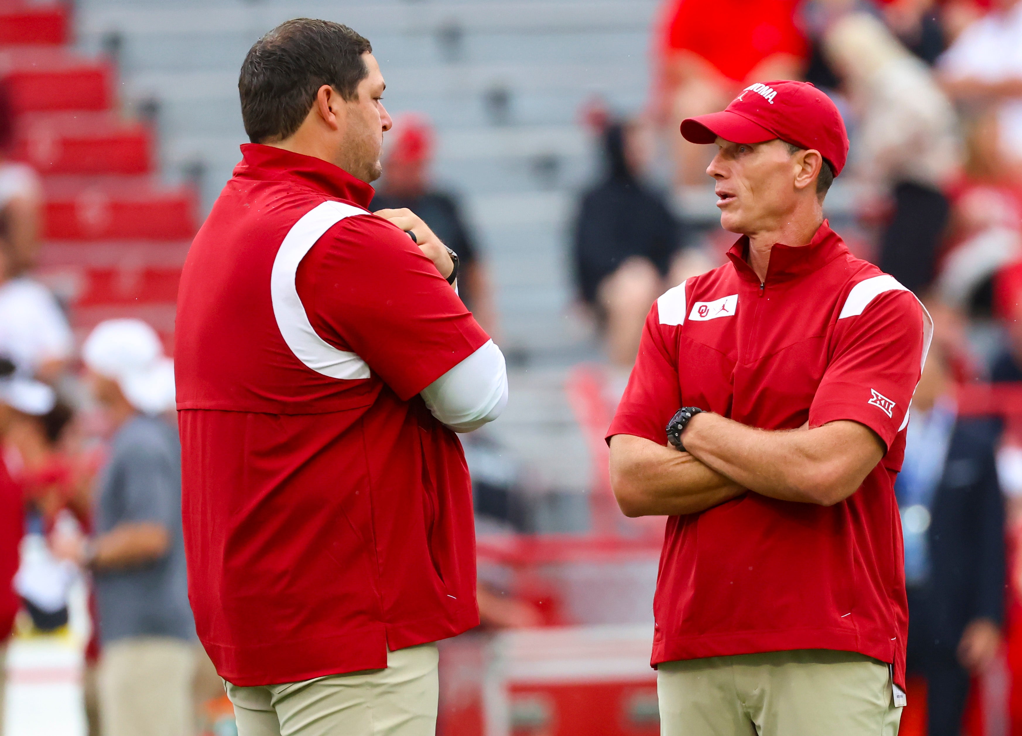 Sep 17, 2022; Lincoln, Nebraska, USA; Oklahoma Sooners offensive coordinator Jeff Lebby speaks with head coach Brent Venables before the game against the Nebraska Cornhuskers at Memorial Stadium.