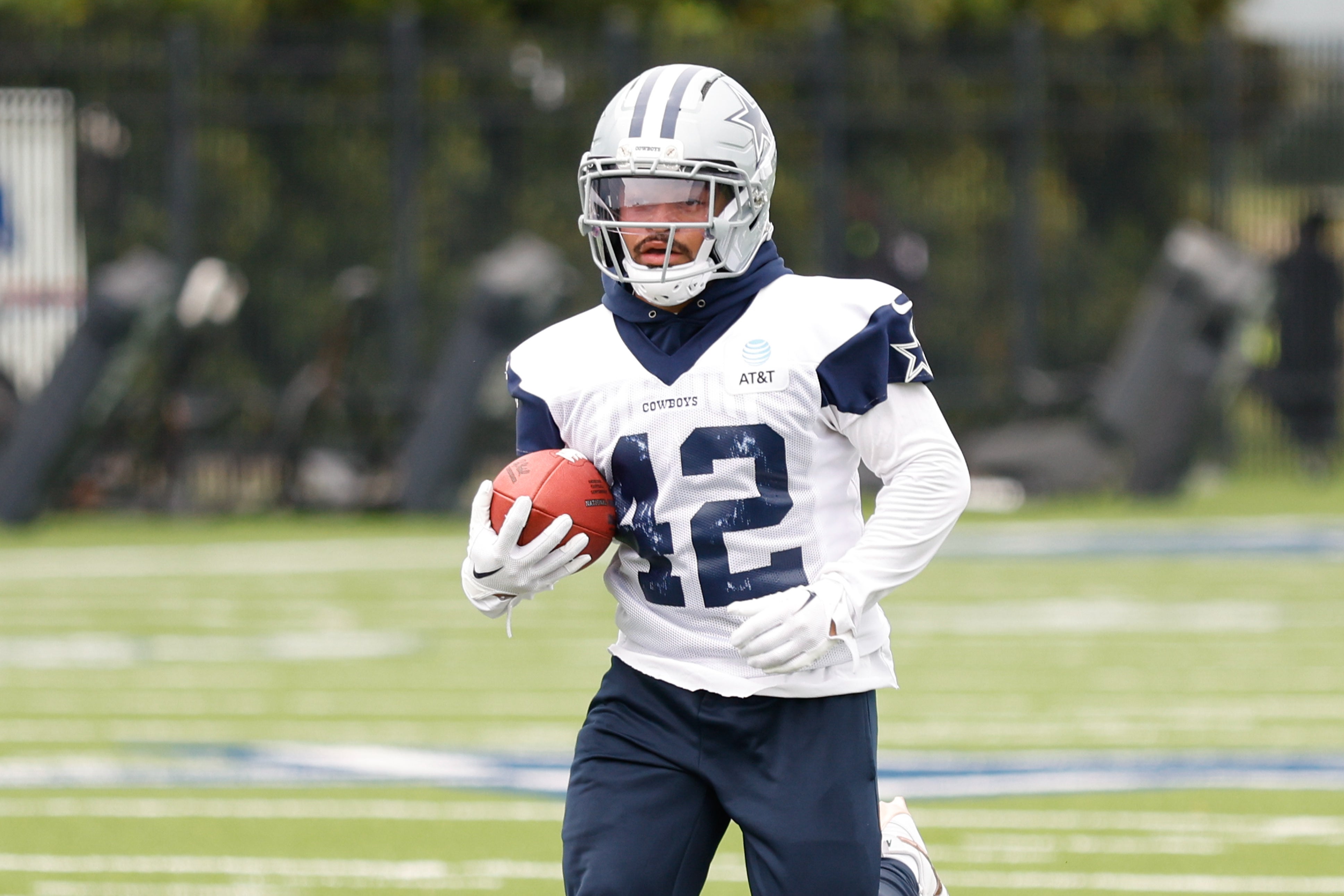 Dallas Cowboys running back Deuce Vaughn (42) goes through a drill during practice at the Ford Center at the Star Training Facility in Frisco, Texas.
