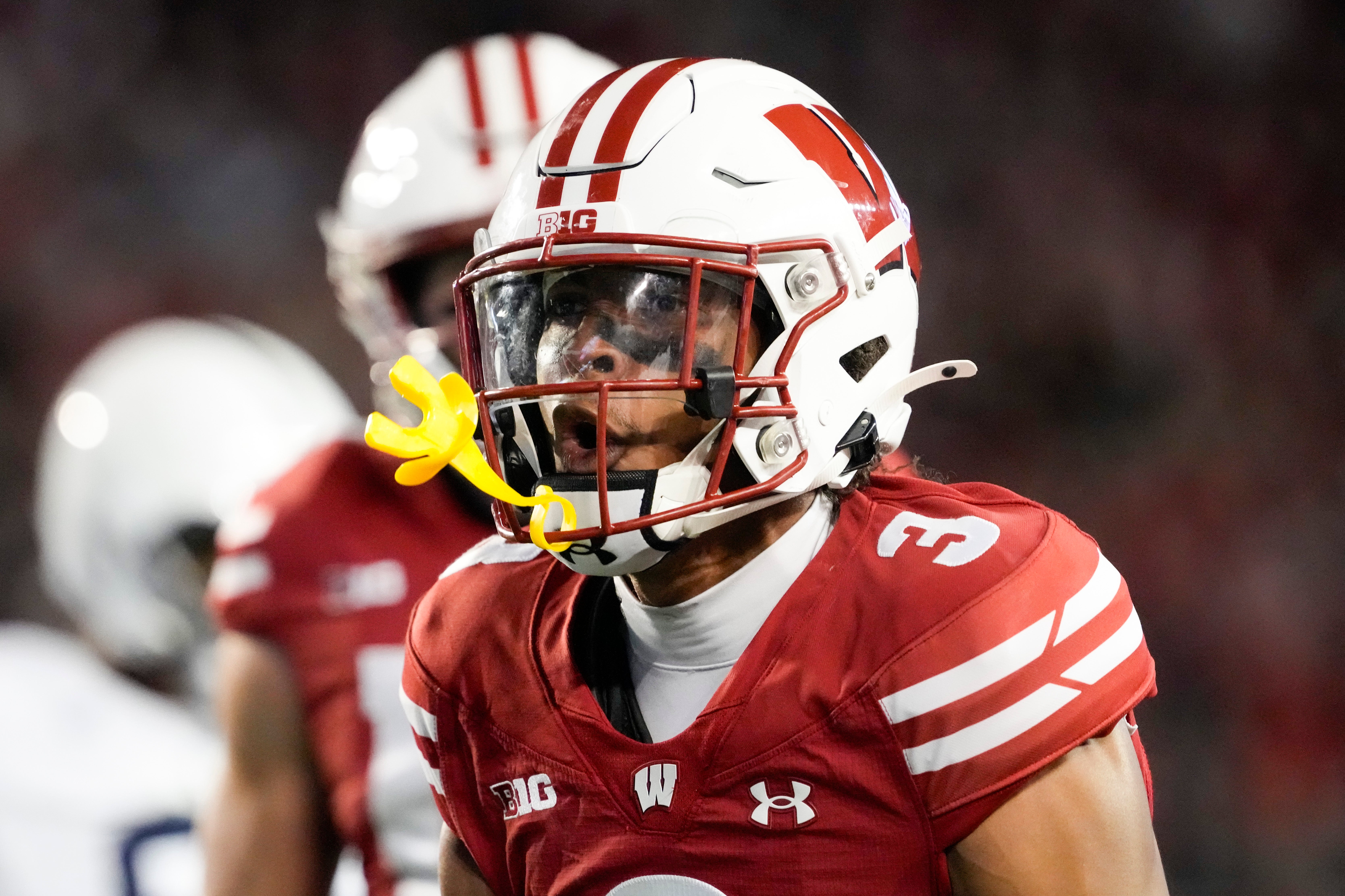 Wisconsin Badgers cornerback Nyzier Fourqurean (3) celebrates following a tackle during the second quarter against the Penn State Nittany Lions at Camp Randall Stadium.