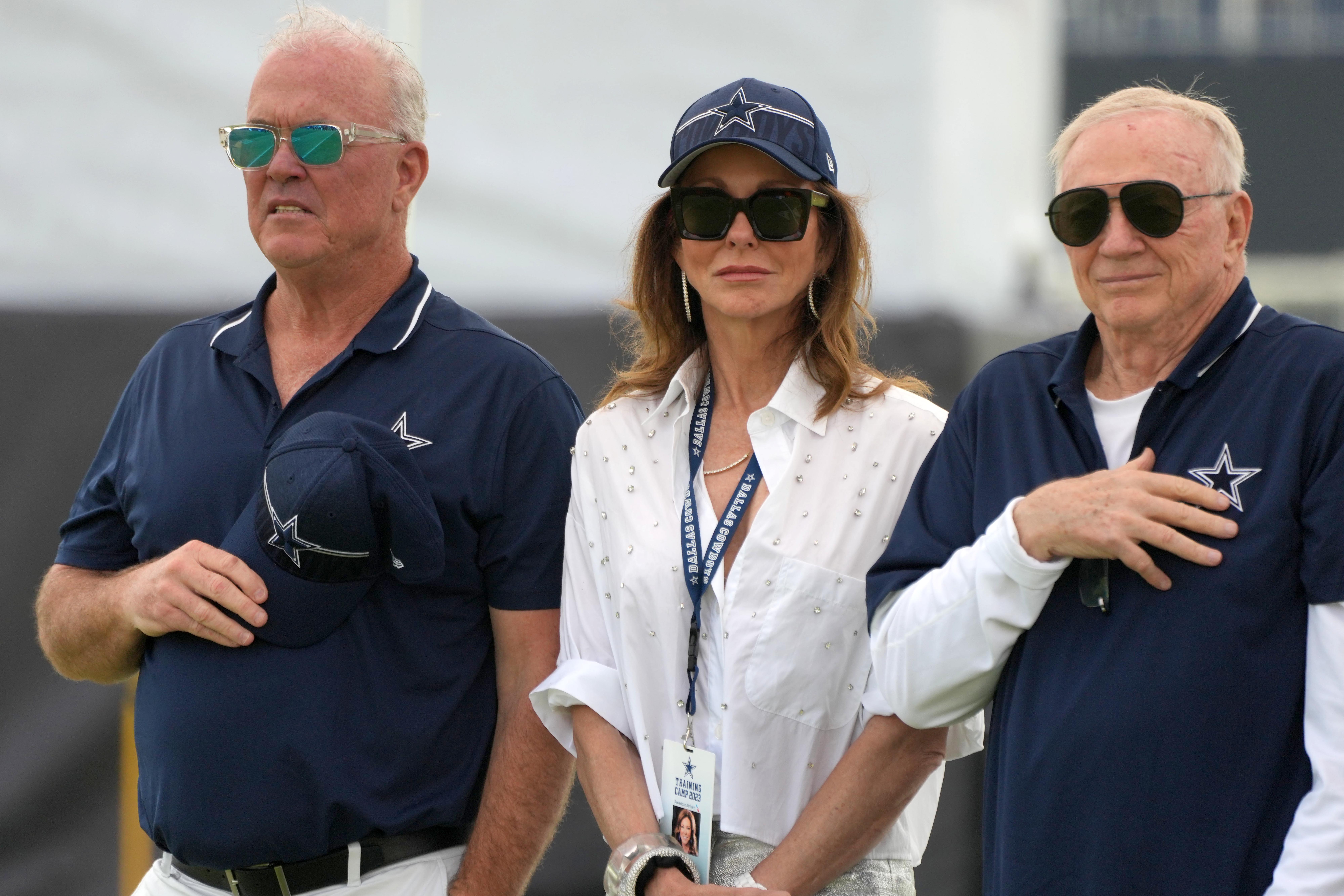 Dallas Cowboys chief operating officer Stephen Jones (left) and chief brand officer Charlotte Jones (center) and owner Jerry Jones during training camp opening ceremonies at the River Ridge Fields.