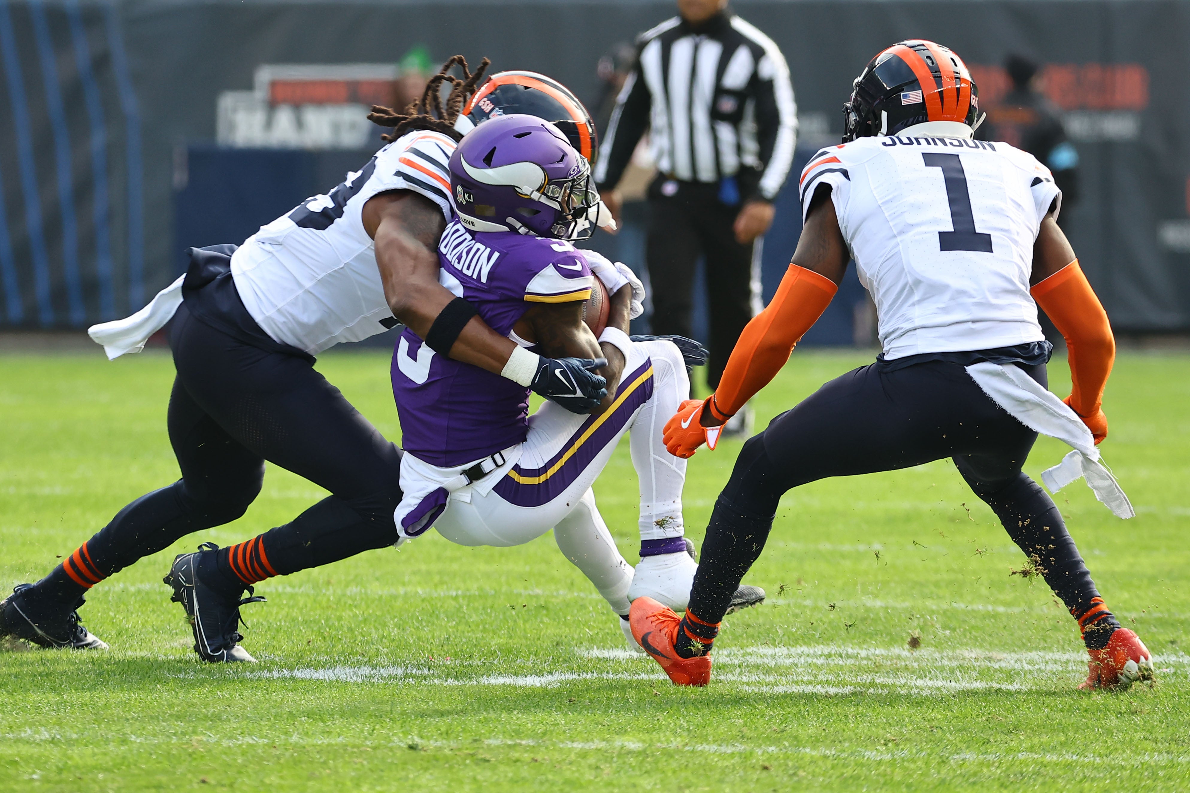 Nov 24, 2024; Chicago, Illinois, USA; Minnesota Vikings wide receiver Jordan Addison (3) makes a catch against Chicago Bears cornerback Jaylon Johnson (1) during the first quarter at Soldier Field.