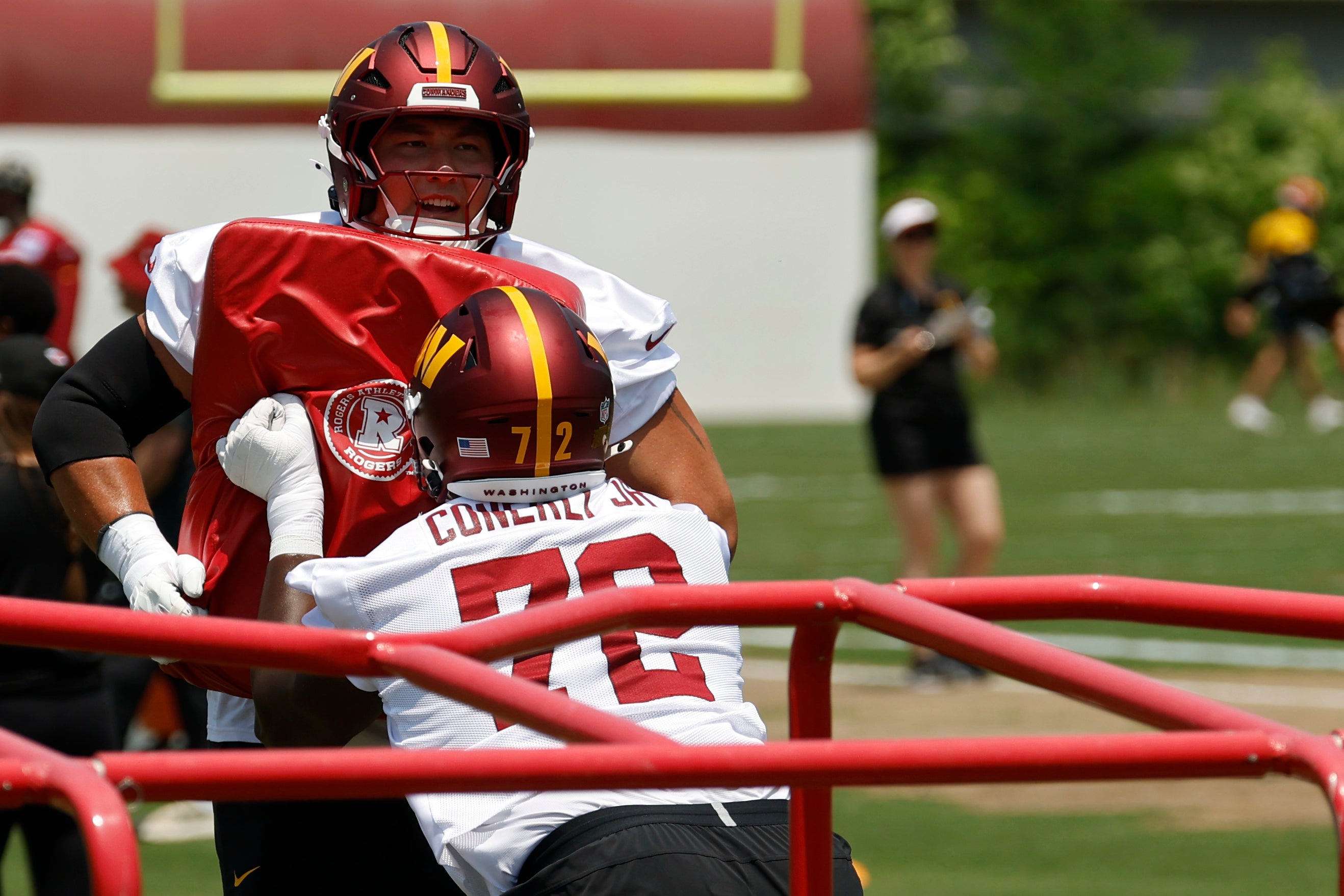 Jun 10, 2025; Ashburn, VA, USA; Washington Commanders offensive tackle Josh Conerly Jr. (72) participates in a blocking drill on day one of minicamp at Commanders Park.