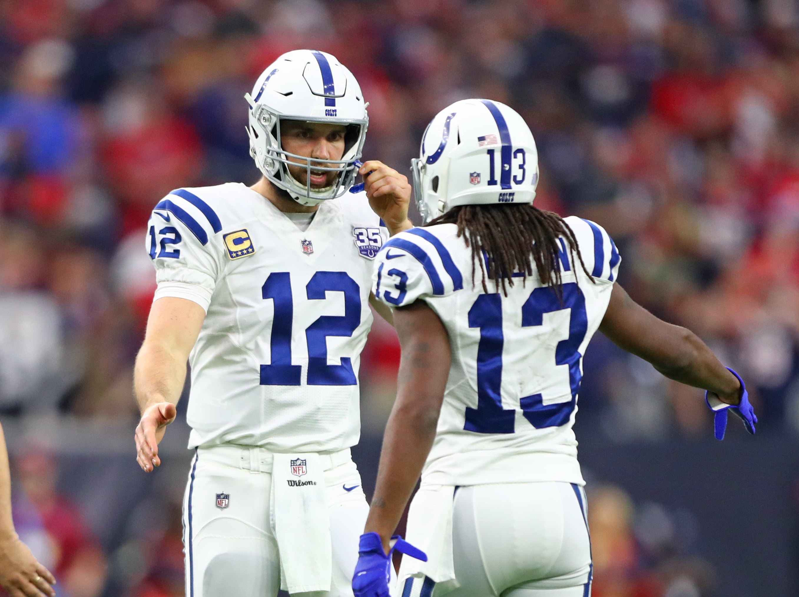 Jan 5, 2019; Houston, TX, USA; Indianapolis Colts quarterback Andrew Luck (12) with wide receiver T.Y. Hilton (13) against the Houston Texans during the AFC Wild Card at NRG Stadium.