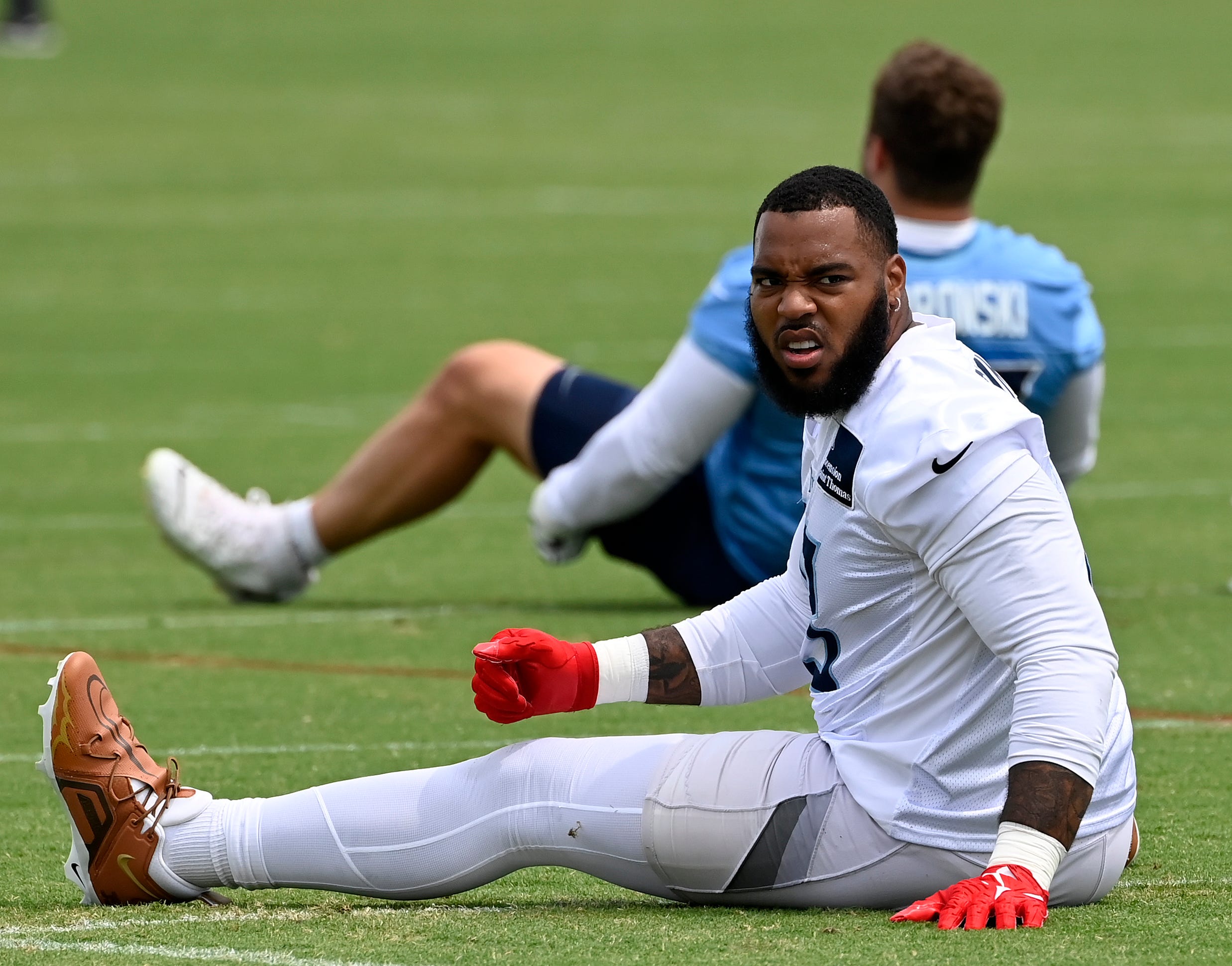 Tennessee Titans defensive tackle Jeffery Simmons (98) stretches during an NFL football minicamp camp practice at Ascension Saint Thomas Sports Park Thursday, June 12, 2025, in Nashville, Tenn.