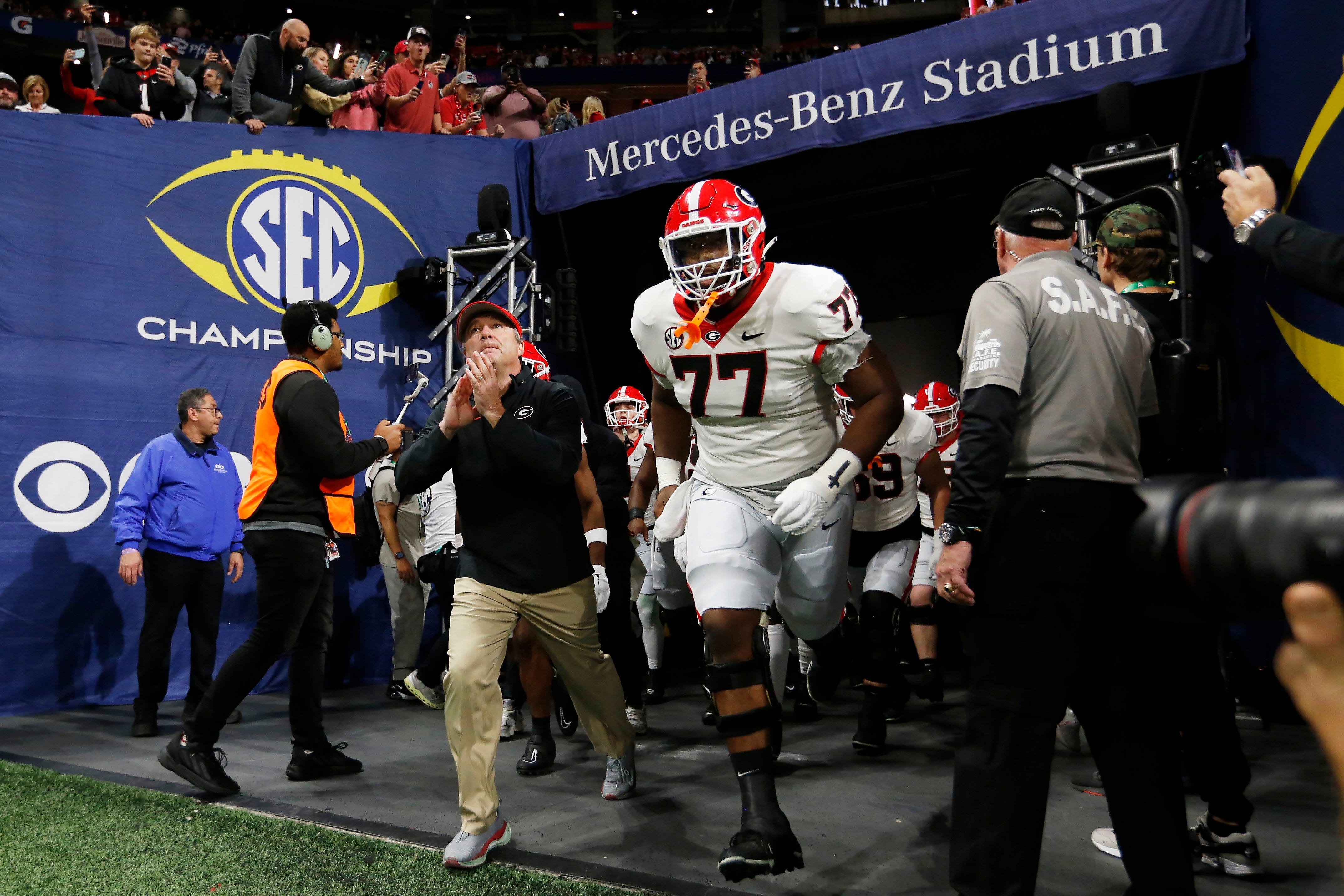 Georgia coach Kirby Smart leads his team onto the field before the start of the SEC Championship game against Alabama at Mercedes-Benz Stadium in Atlanta, on Saturday, Dec. 2, 2023.
