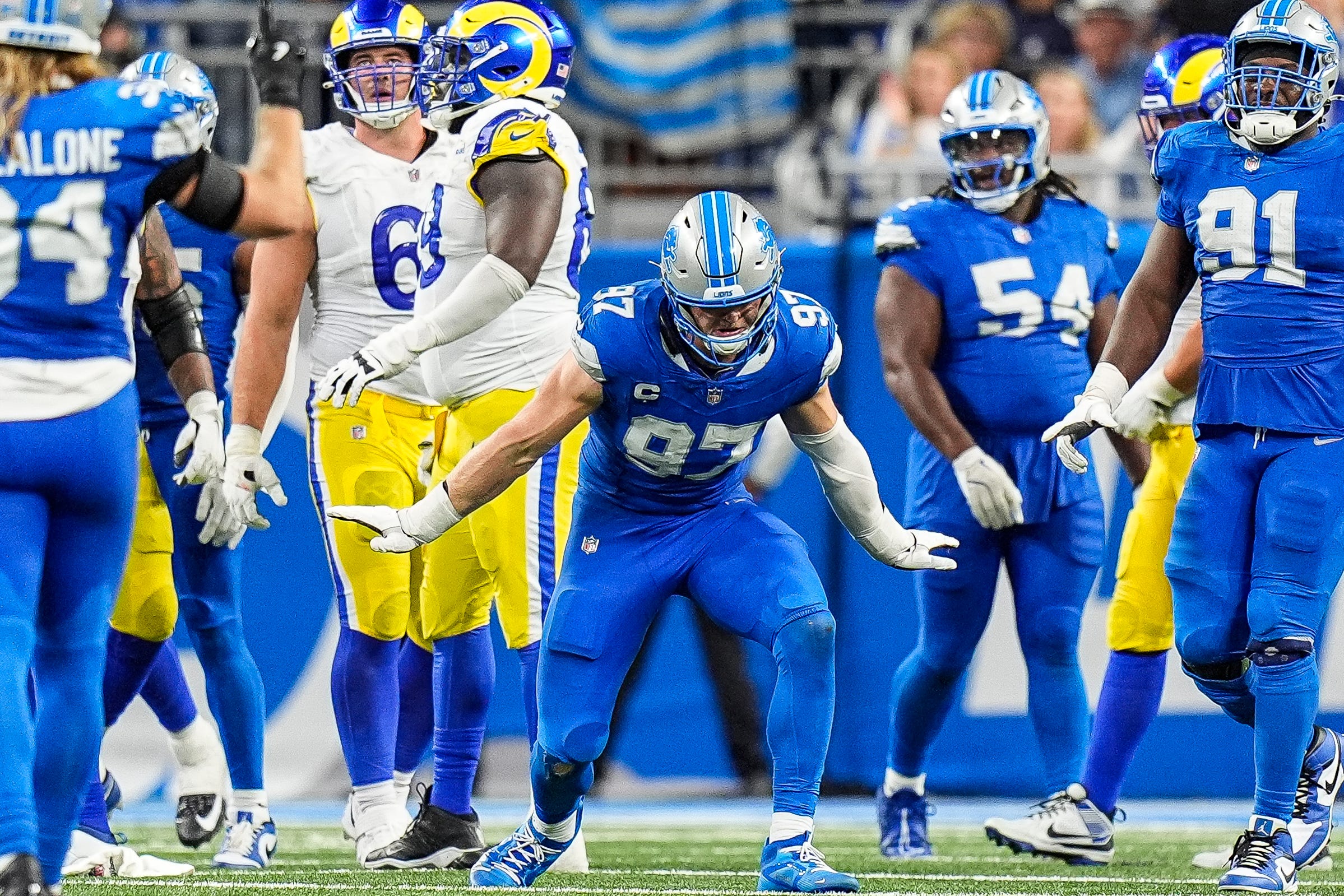 Detroit Lions defensive end Aidan Hutchinson (97) celebrates a sack against Los Angeles Rams quarterback Matthew Stafford (9) during the second half at Ford Field in Detroit on Sunday, September 8, 2024.