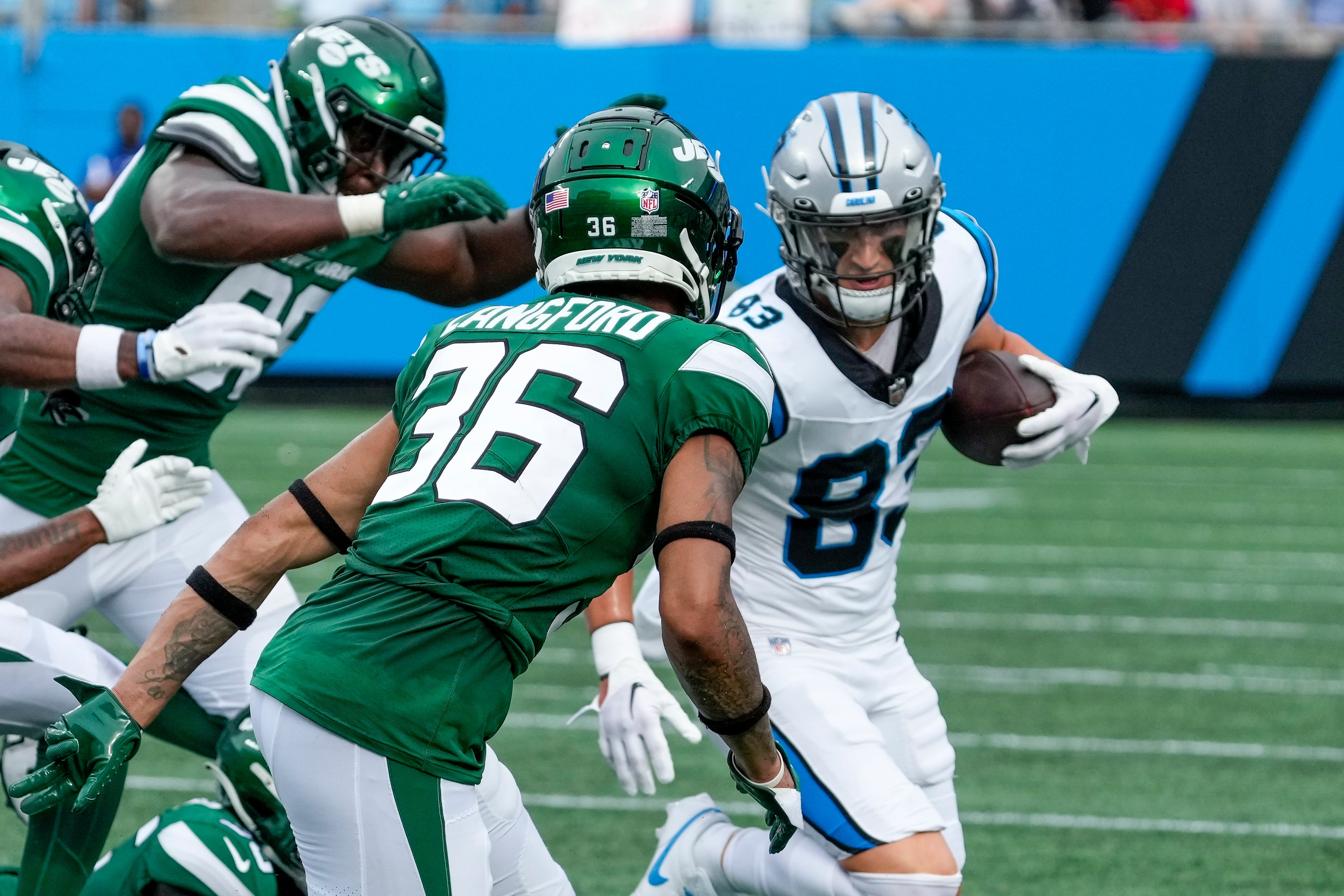 Carolina Panthers wide receiver Derek Wright (83) tries to outrun New York Jets cornerback Derrick Langford (36) during the second half at Bank of America Stadium.