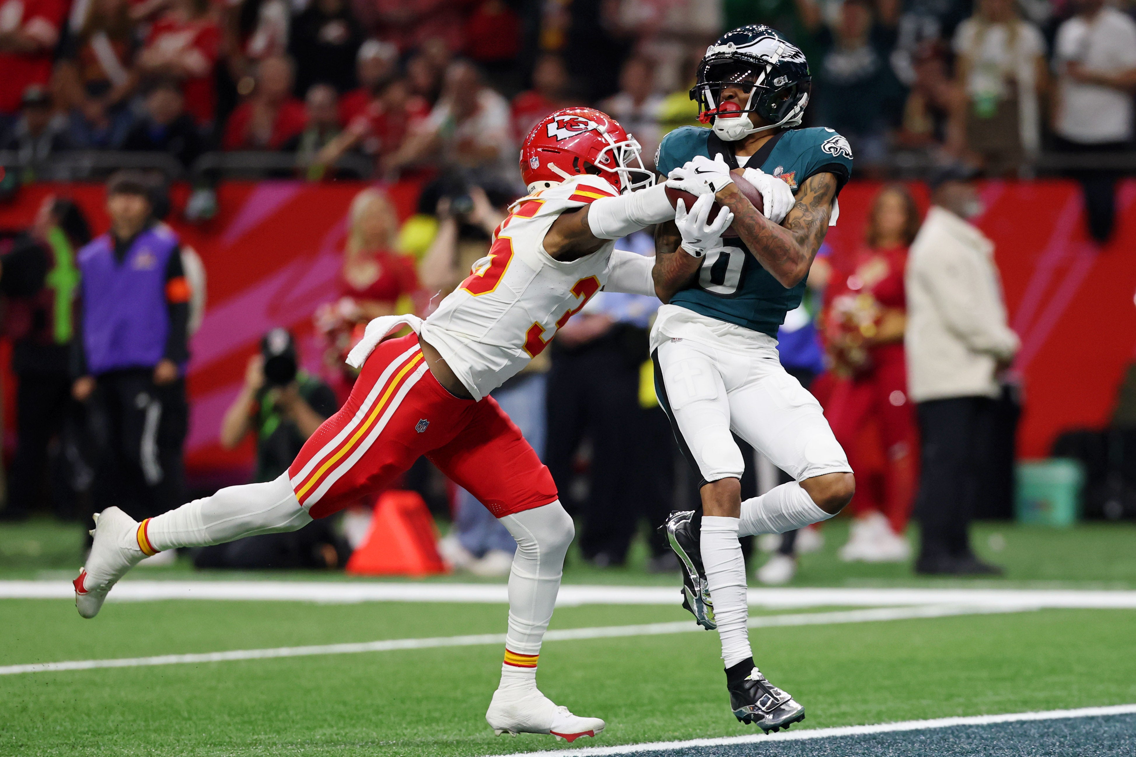 Philadelphia Eagles wide receiver DeVonta Smith (6) makes a catch for a touchdown against Kansas City Chiefs cornerback Jaylen Watson (35) during the second half of Super Bowl LIX at Caesars Superdome.