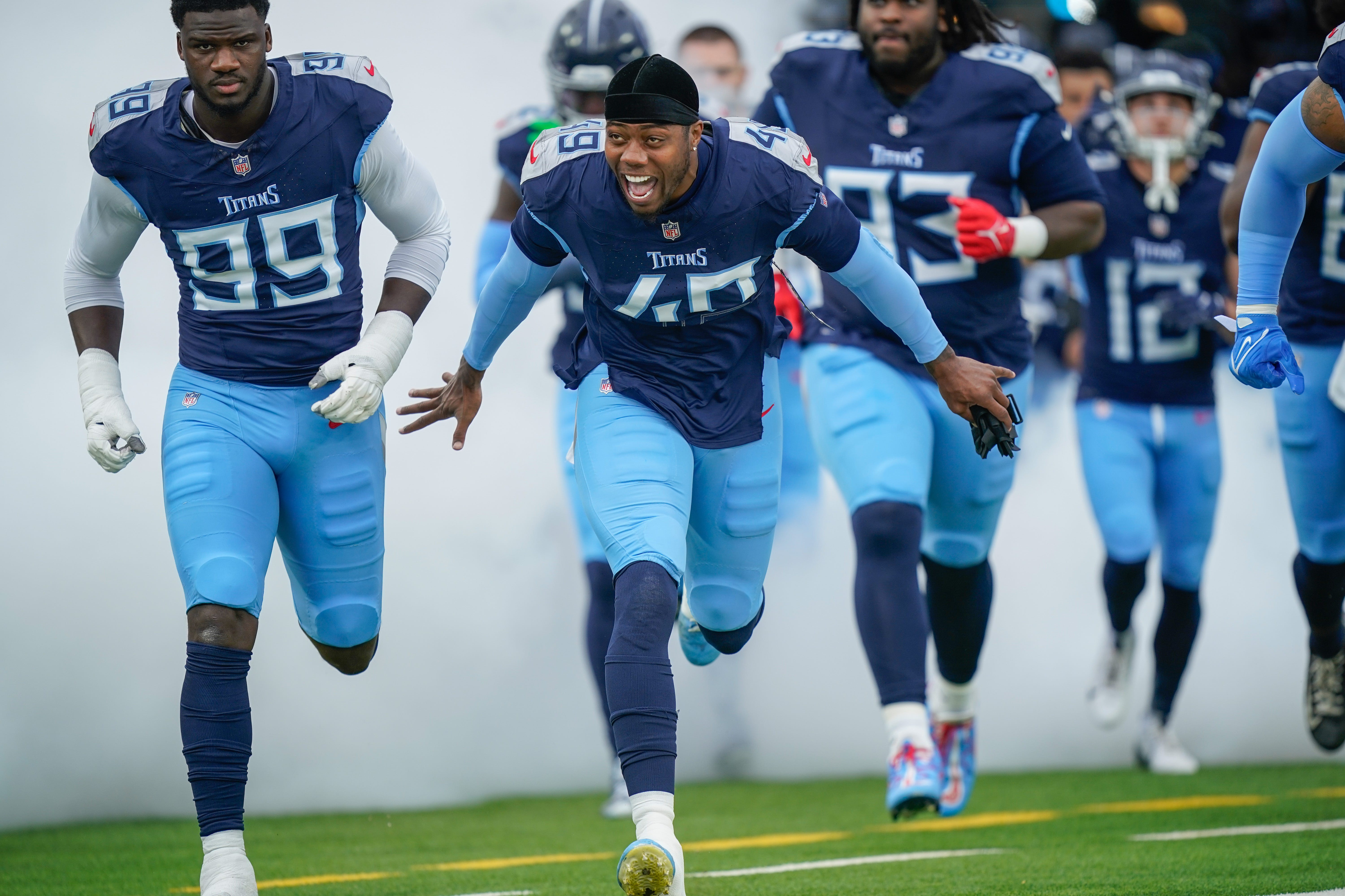 Tennessee Titans linebacker Arden Key (49) runs onto the field before the Titans play the Bengals at Nissan Stadium in Nashville, Tenn., Sunday, Dec. 15, 2024.