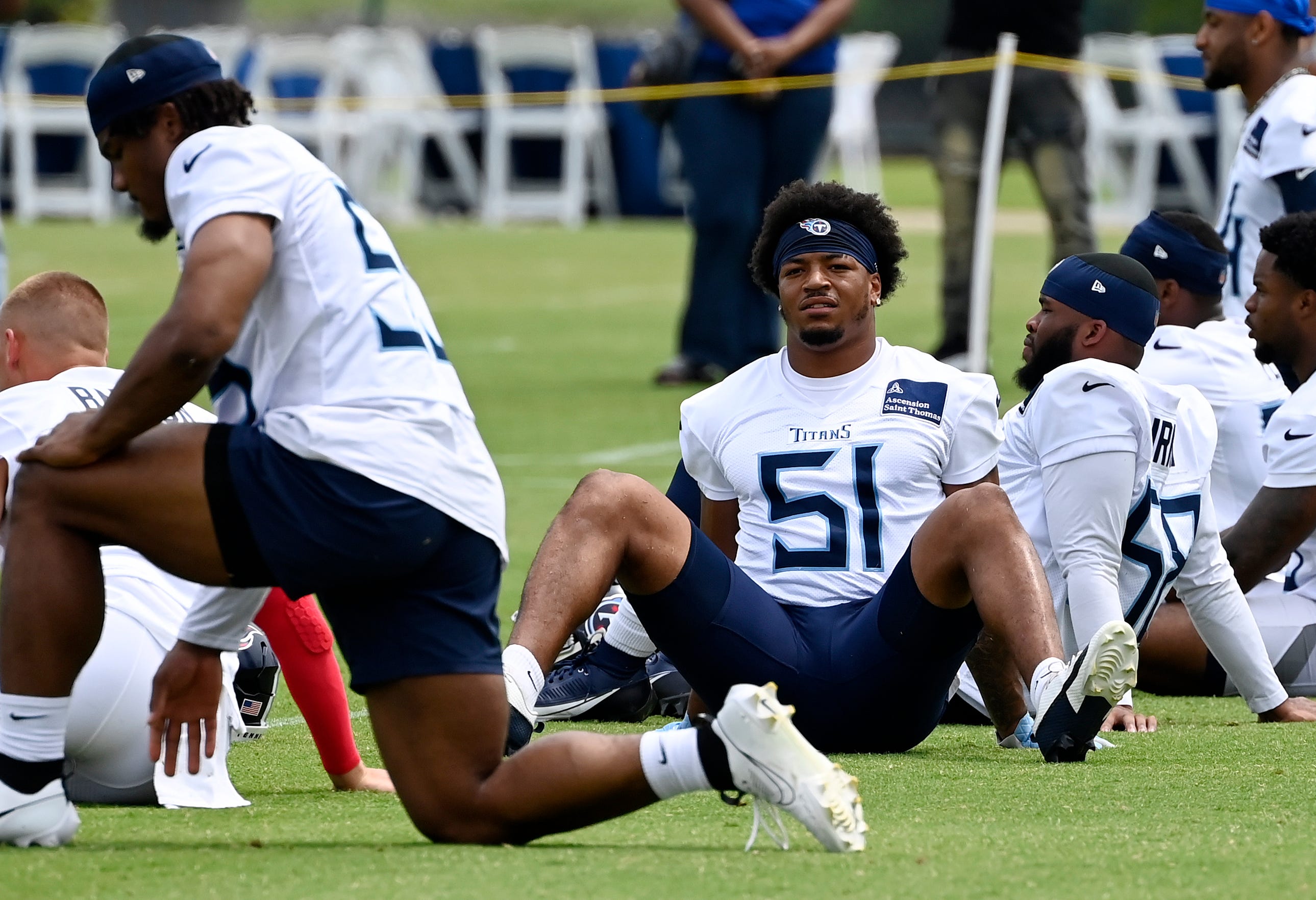 Tennessee Titans linebacker Cedric Gray (51) stretches during an NFL football minicamp camp practice at Ascension Saint Thomas Sports Park Thursday, June 12, 2025, in Nashville, Tenn.