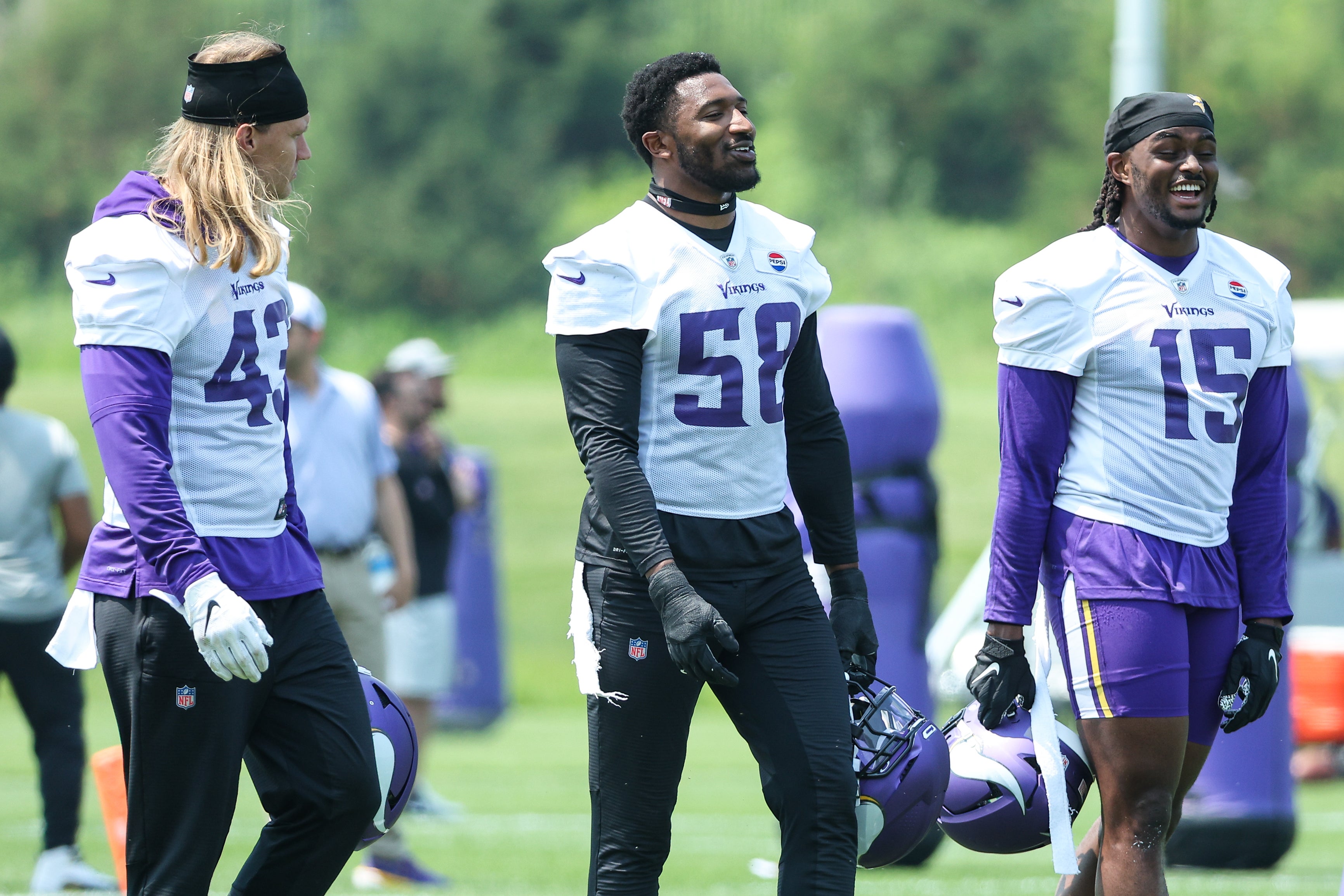 Jun 10, 2025; Minneapolis, MN, USA; Minnesota Vikings linebacker Andrew Van Ginkel (43), linebacker Jonathan Greenard (58) and linebacker Dallas Turner (15) talk during minicamp at the Minnesota Vikings Training Facility.