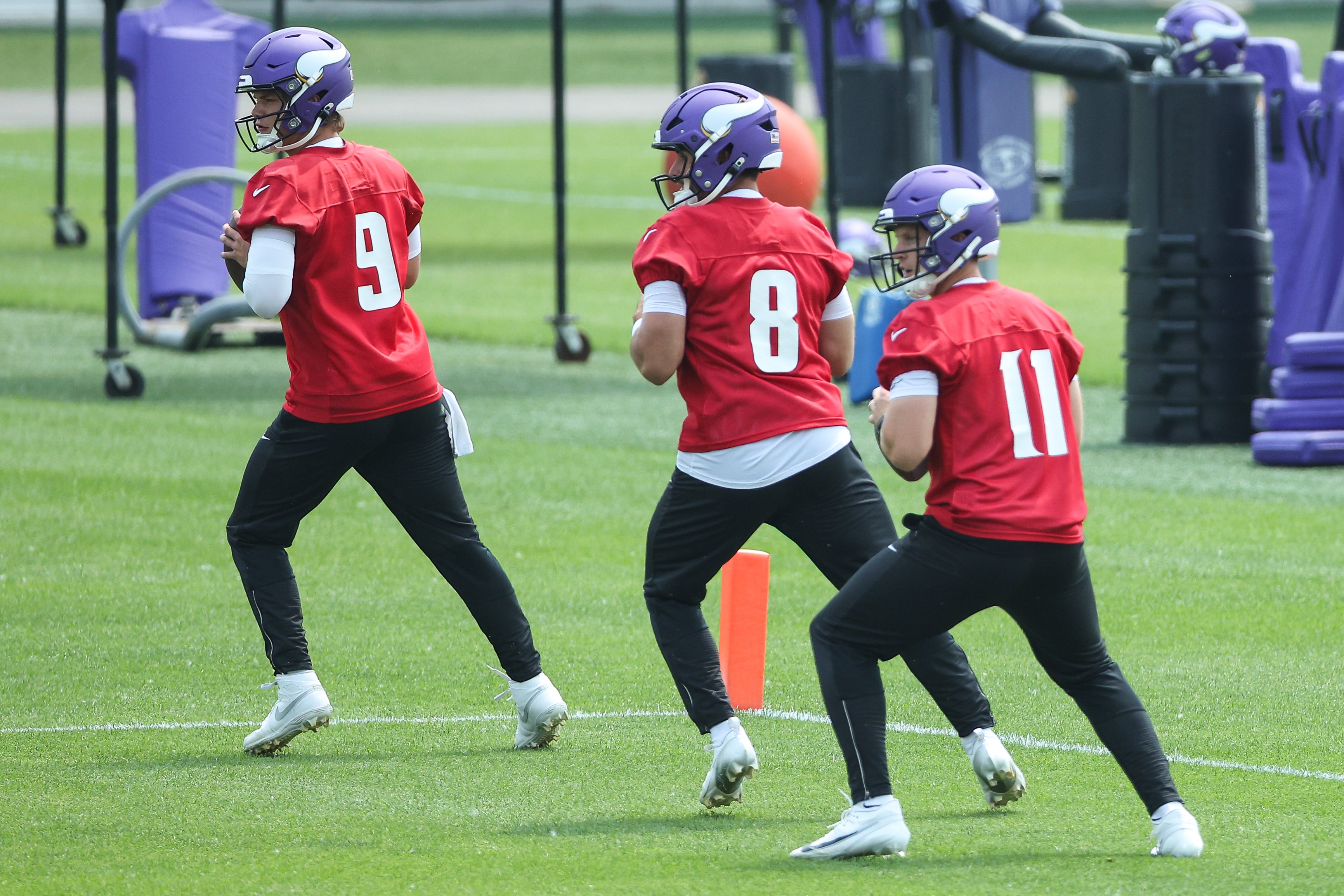 Jun 10, 2025; Minneapolis, MN, USA; Minnesota Vikings quarterback J.J. McCarthy (9), quarterback Sam Howell (8) and quarterback Brett Rypien (11) practice during minicamp at the Minnesota Vikings Training Facility.