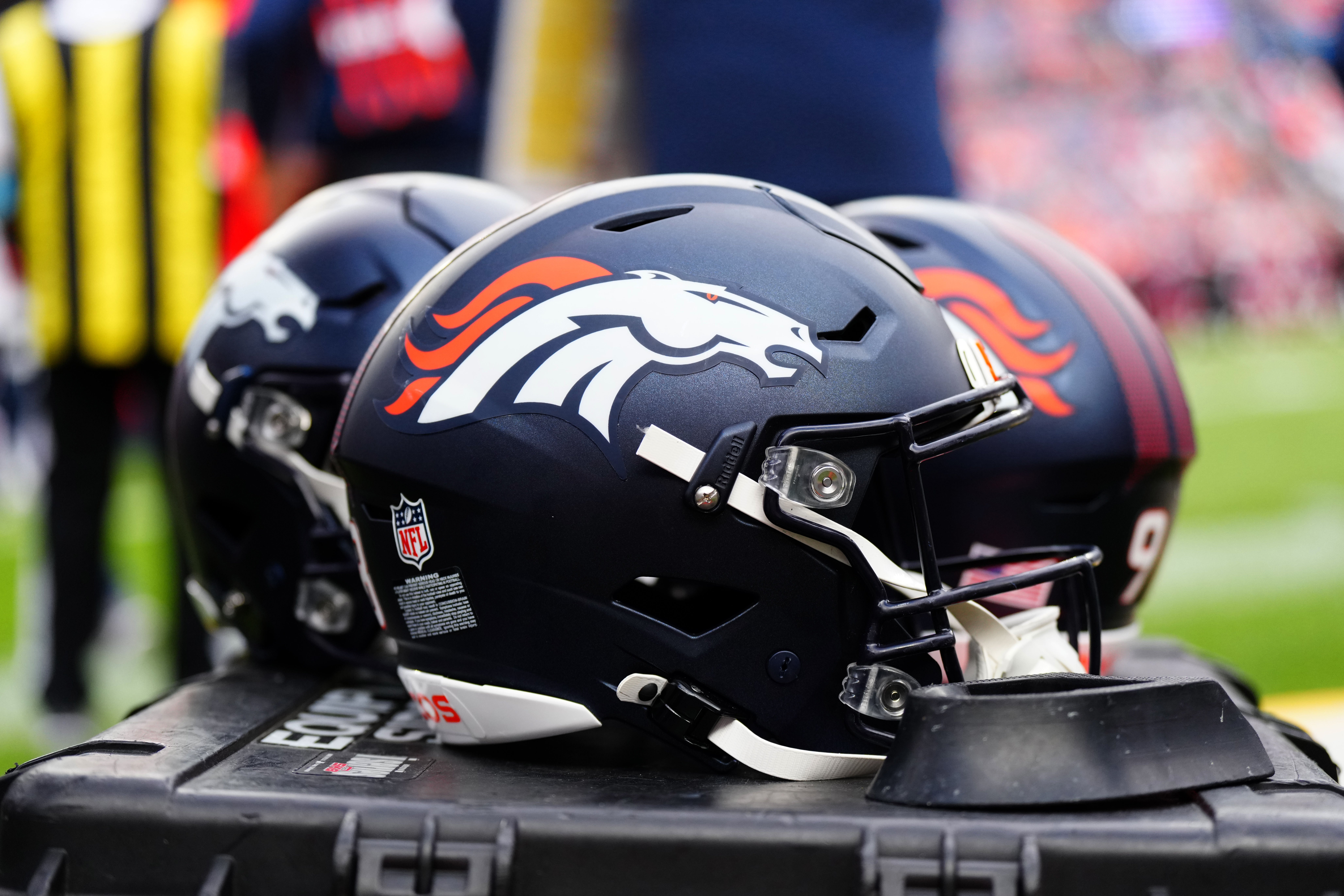 Aug 25, 2024; Denver, Colorado, USA; Detail view of the helmets worn by the Denver Broncos during the second half against the Arizona Cardinals at Empower Field at Mile High.