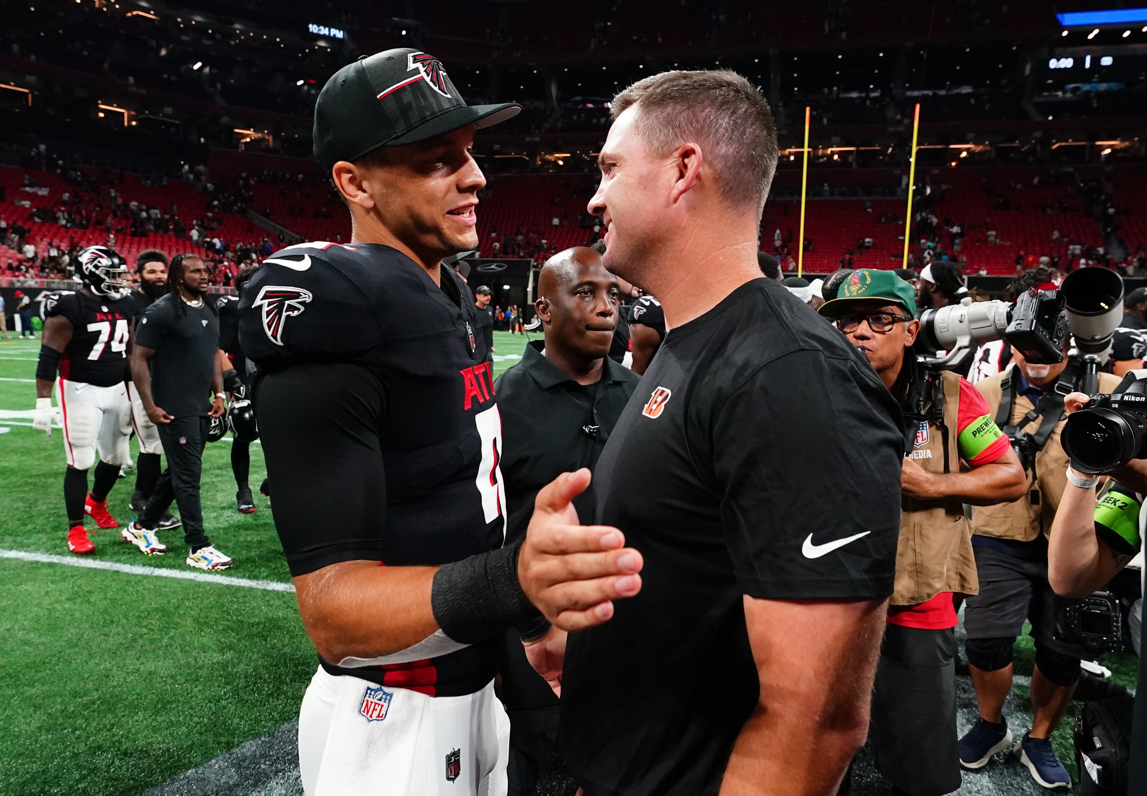 Aug 18, 2023; Atlanta, Georgia, USA; Atlanta Falcons quarterback Desmond Ridder (9) greets Cincinnati Bengals head coach Zac Taylor following their 13-13 tie at Mercedes-Benz Stadium.