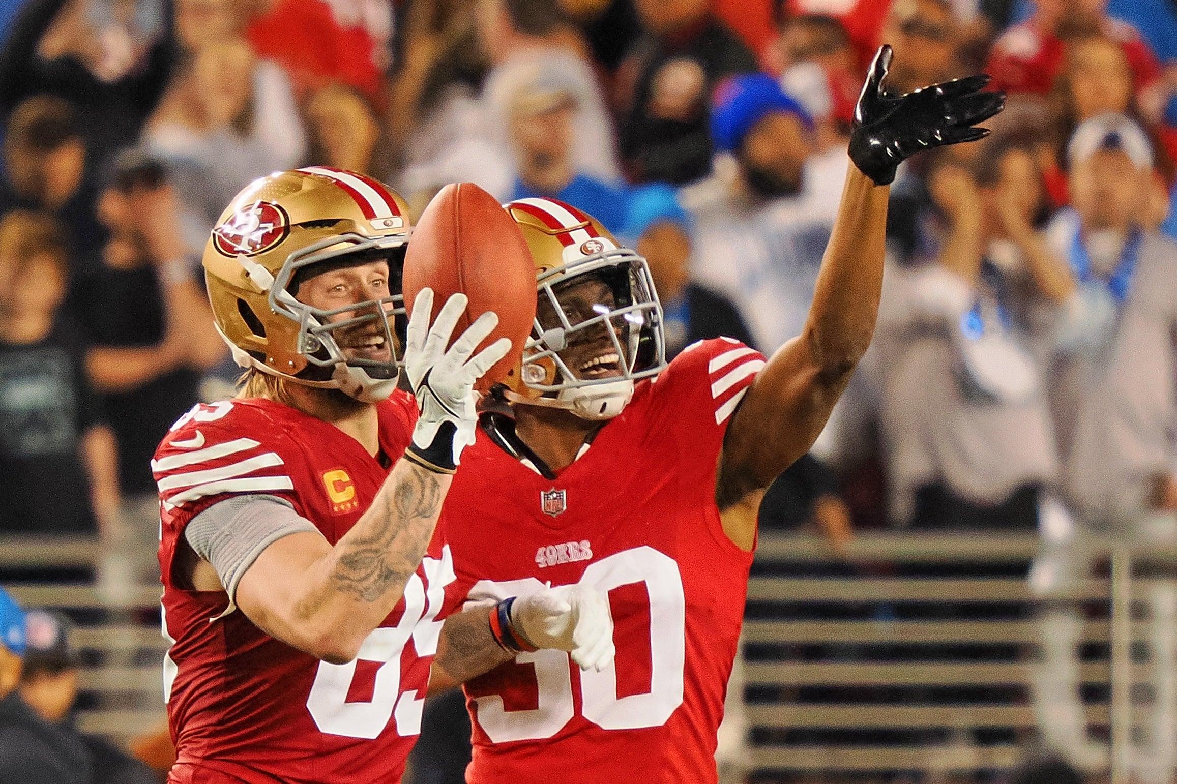 Jan 28, 2024; Santa Clara, California, USA; San Francisco 49ers tight end George Kittle (85) and safety George Odum (30) celebrates after a play against the Detroit Lions during the second half of the NFC Championship football game at Levi's Stadium.