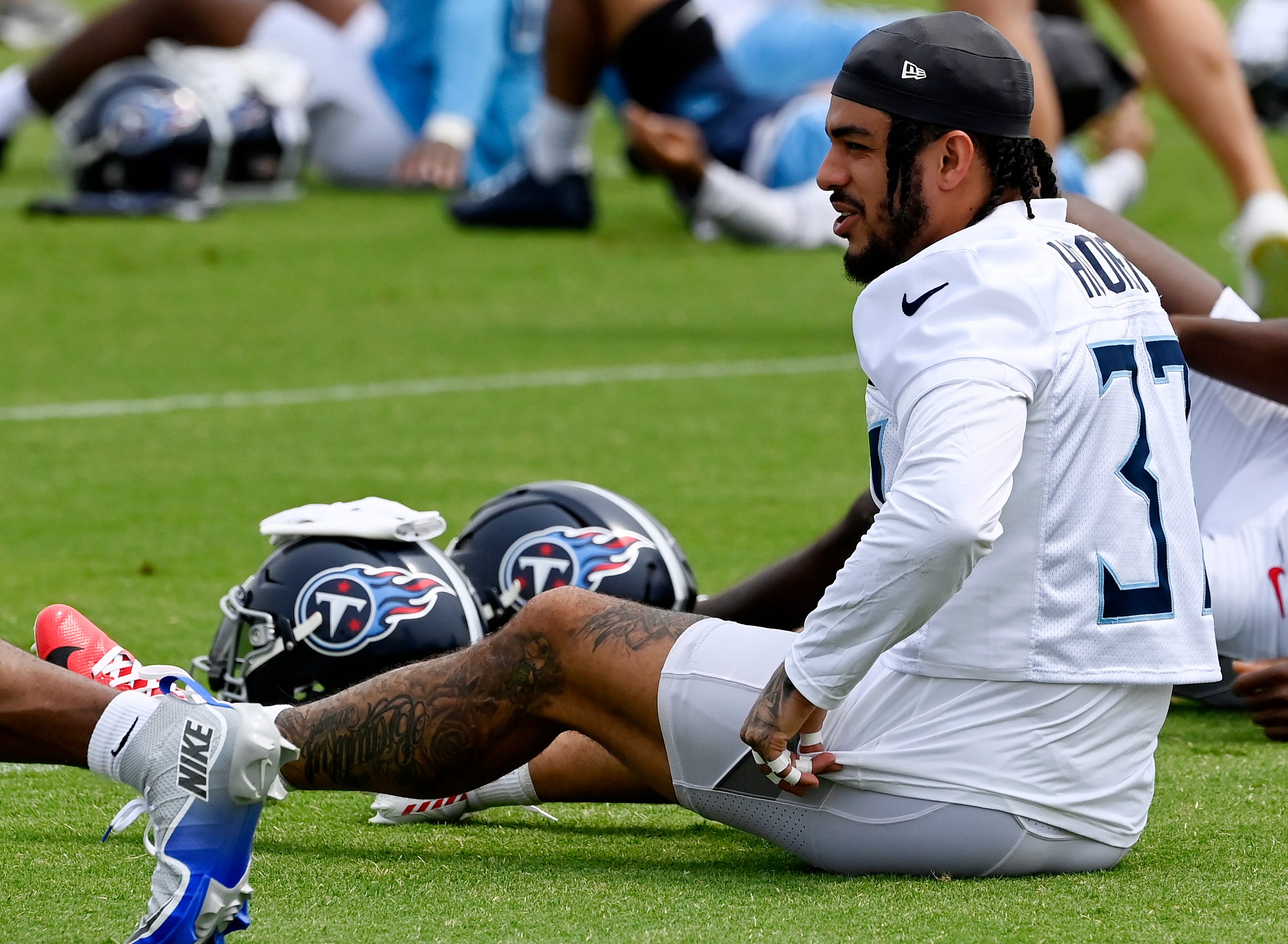 Tennessee Titans safety Amani Hooker (37) stretches during an NFL football minicamp camp practice at Ascension Saint Thomas Sports Park Thursday, June 12, 2025, in Nashville, Tenn.