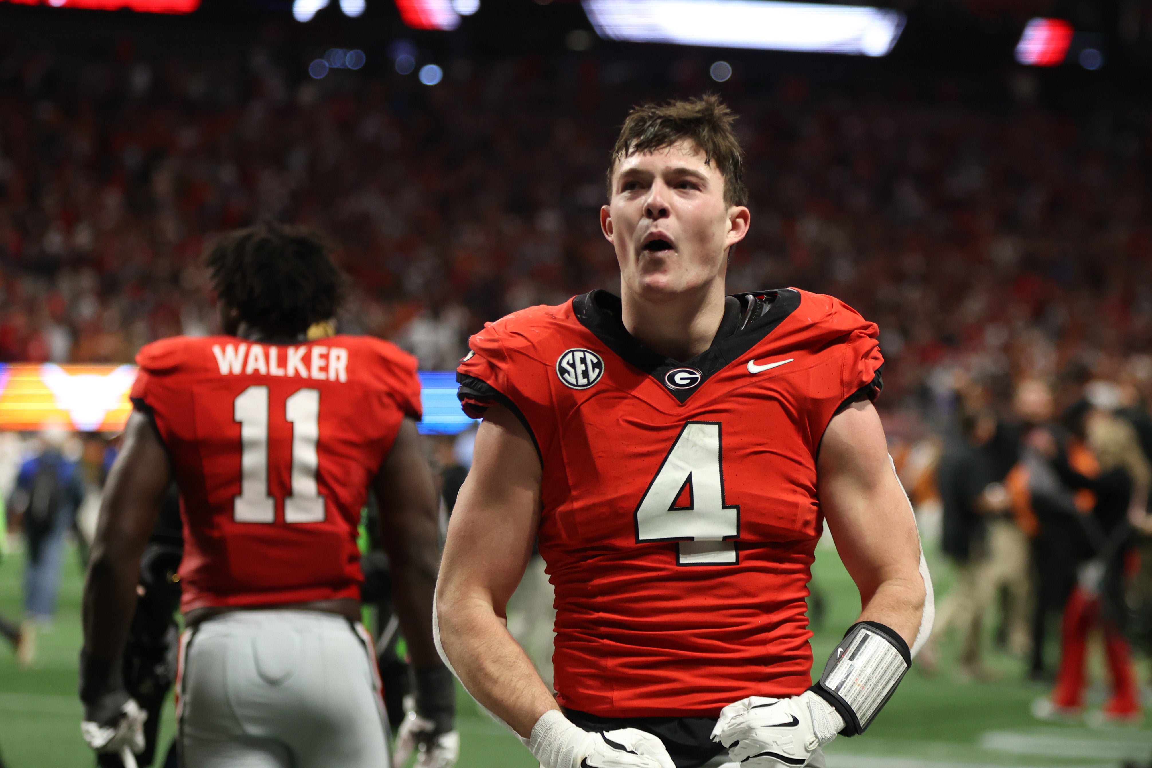 Georgia Bulldogs tight end Oscar Delp (4) reacts after defeating the Texas Longhorns in overtime in the 2024 SEC Championship game at Mercedes-Benz Stadium.