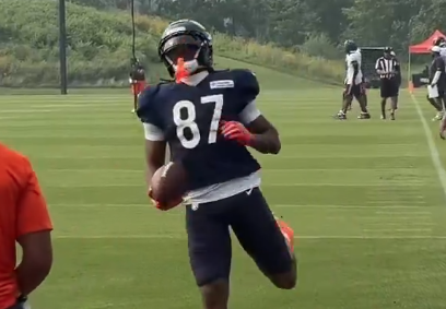 Luther Burden III runs into the endzone during a training camp practice.