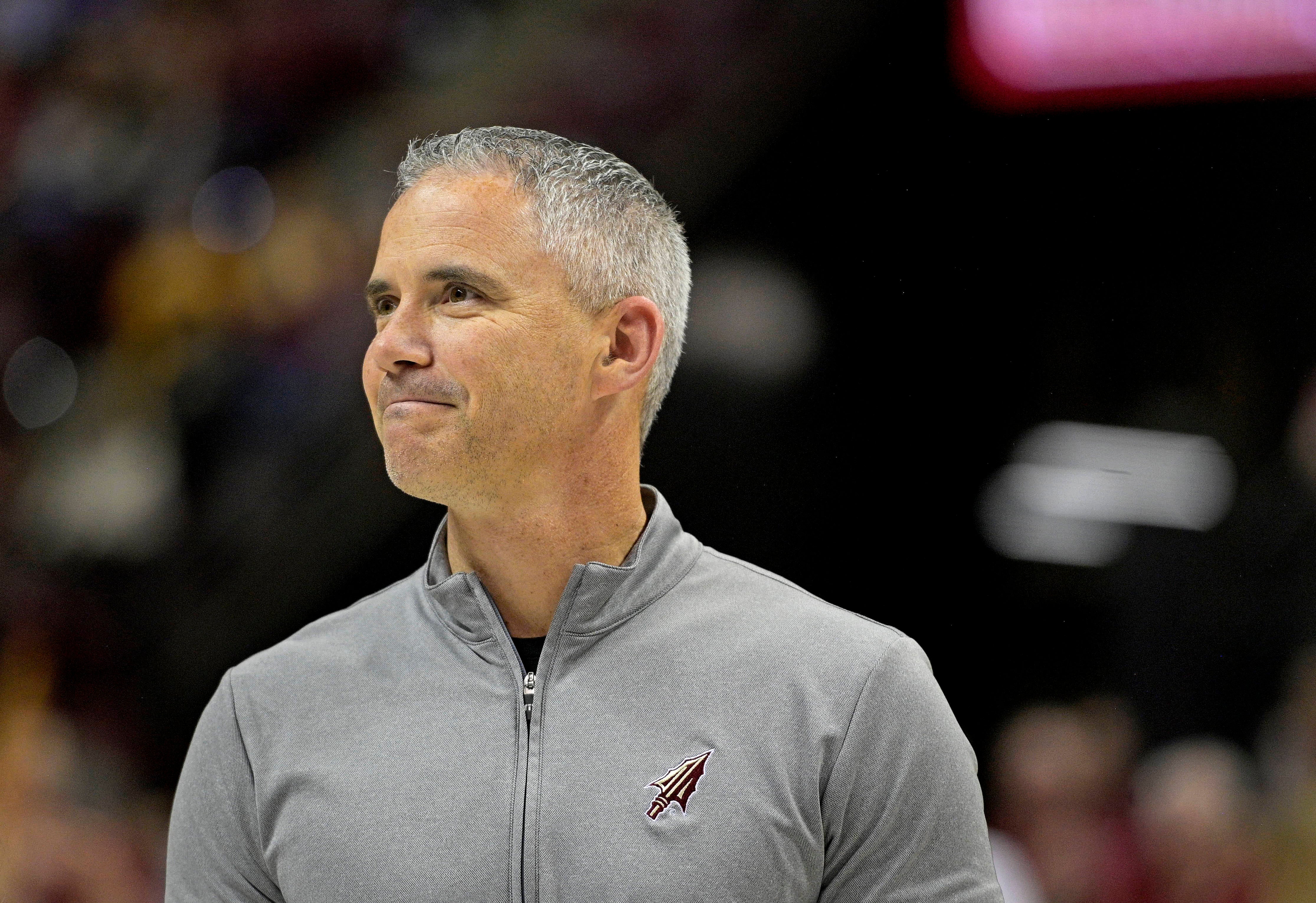 Florida State Seminoles football head coach Mike Norvell smiling