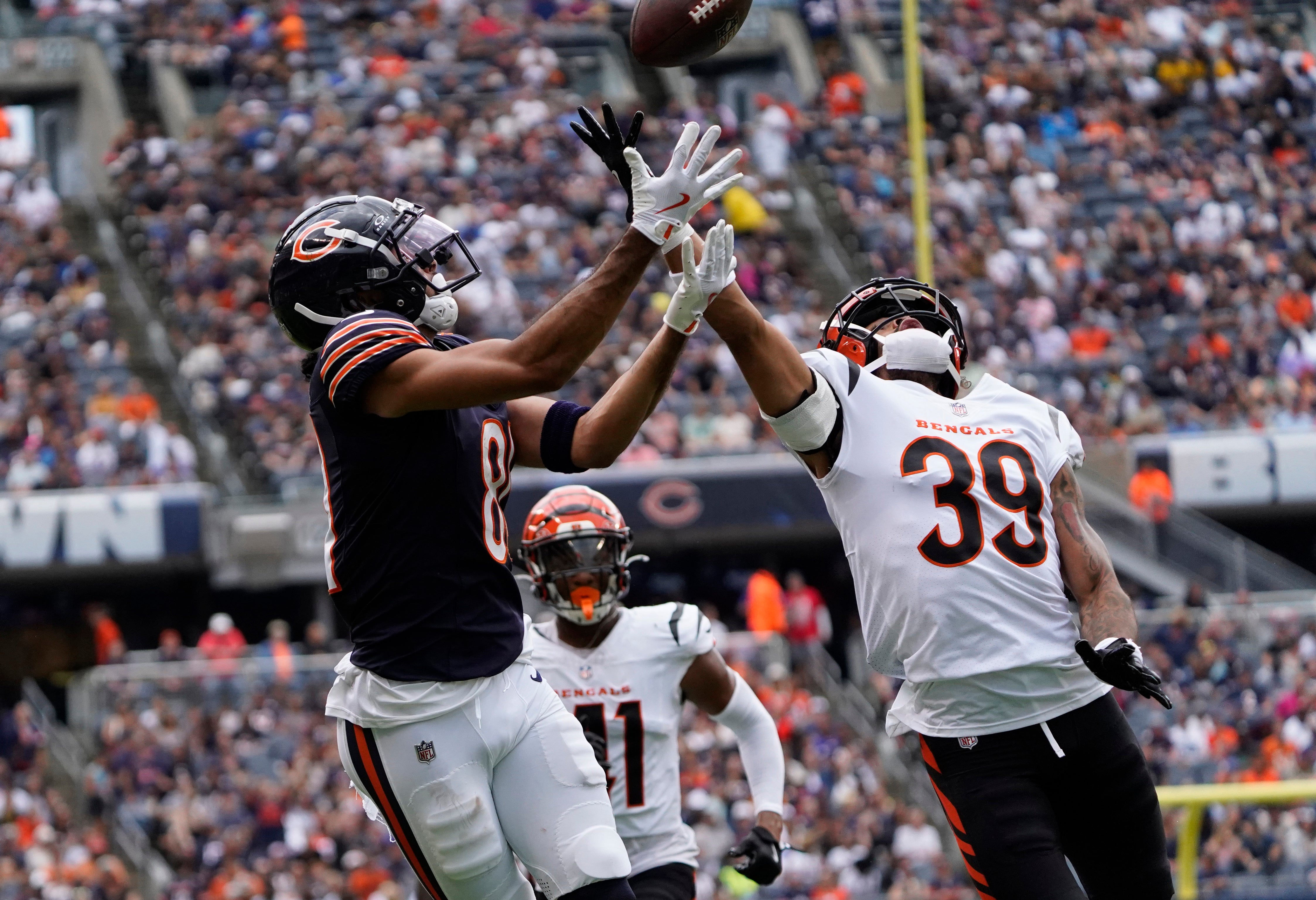 Aug 17, 2024; Chicago, Illinois, USA; Chicago Bears wide receiver Dante Pettis (81) catches a touchdown pass as Cincinnati Bengals cornerback Lance Robinson (39) defends him during the second half at Soldier Field.