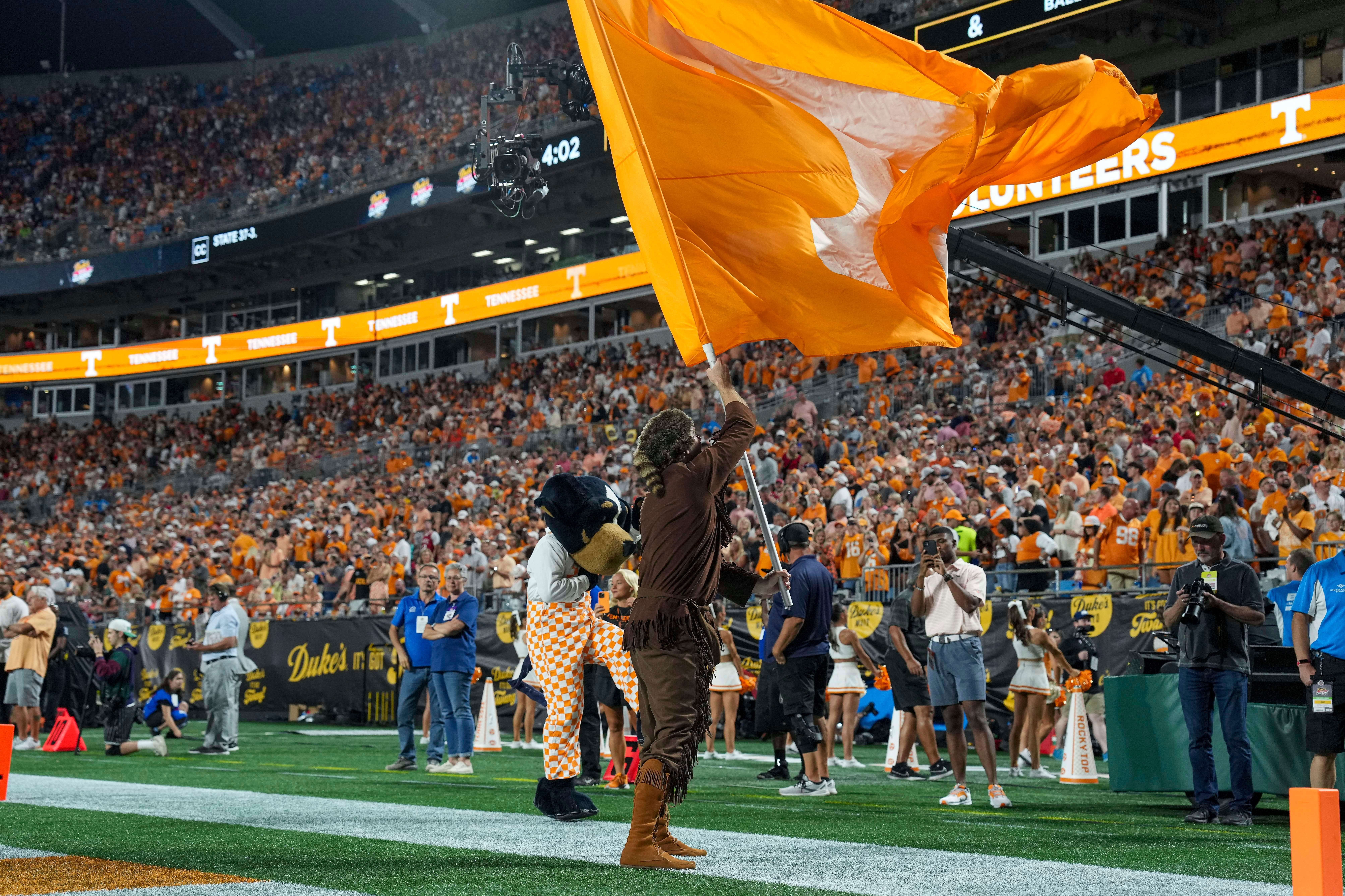 Sep 7, 2024; Charlotte, North Carolina, USA; Tennessee Volunteers mascots the Volunteer and Smoky celebrate a touchdown during the second half against the North Carolina State Wolfpack at the Dukes Mayo Classic at Bank of America Stadium.