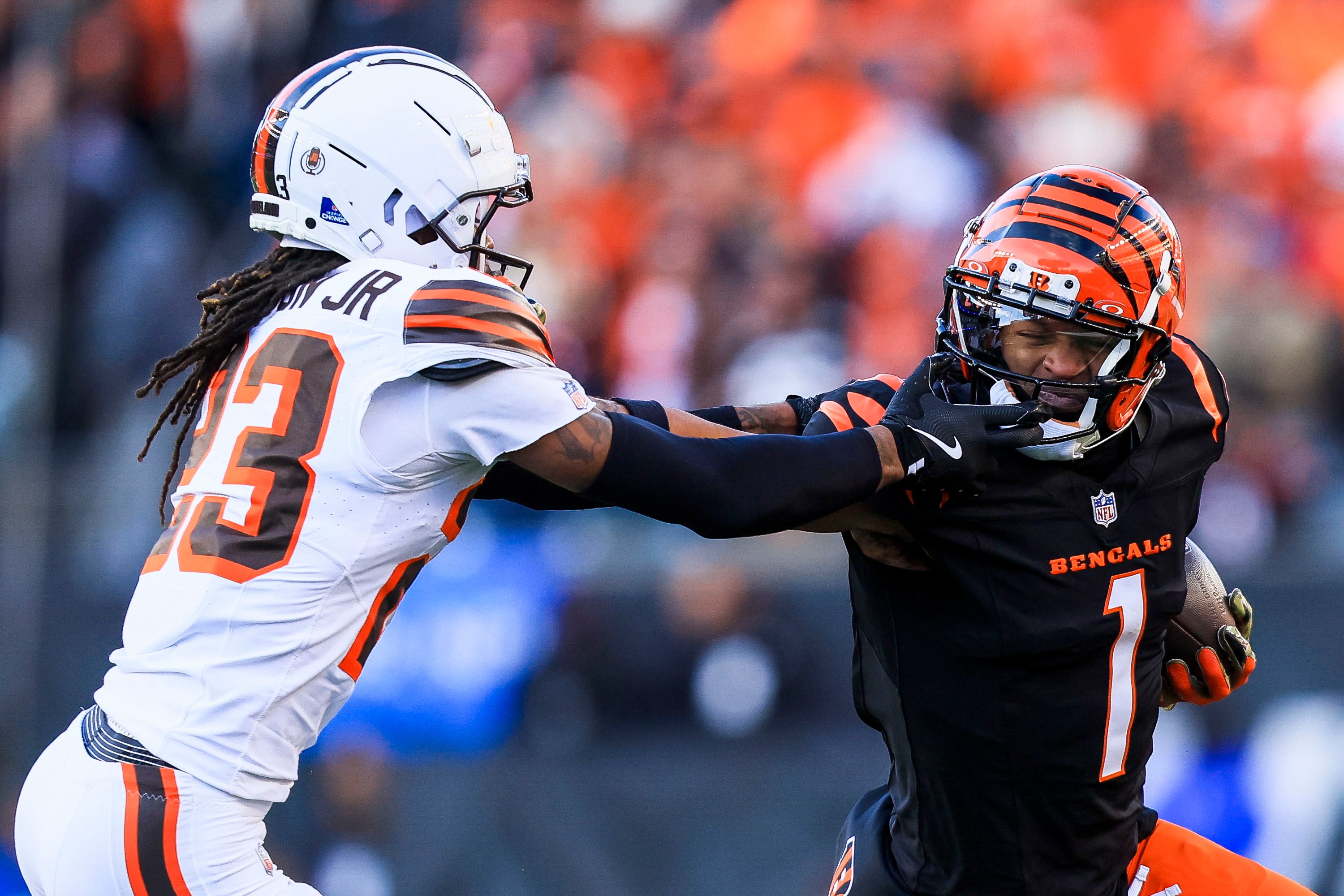 Dec 22, 2024; Cincinnati, Ohio, USA; Cincinnati Bengals wide receiver Ja'Marr Chase (1) runs with the ball against Cleveland Browns cornerback Martin Emerson Jr. (23) in the second half at Paycor Stadium.