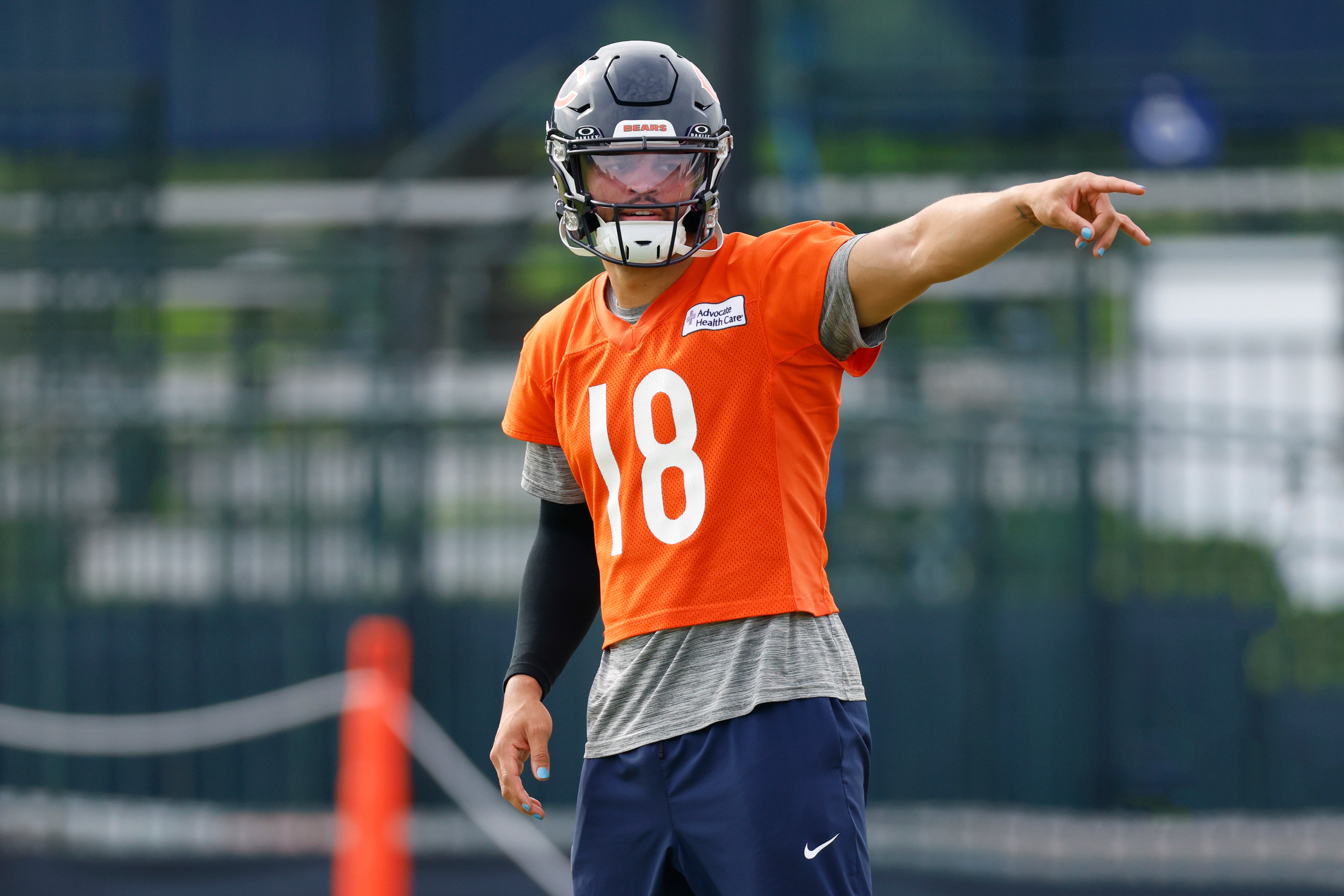 Jul 24, 2025; Lake Forest, IL, USA; Chicago Bears quarterback Caleb Williams (18) signals during training camp at Halas Hall.