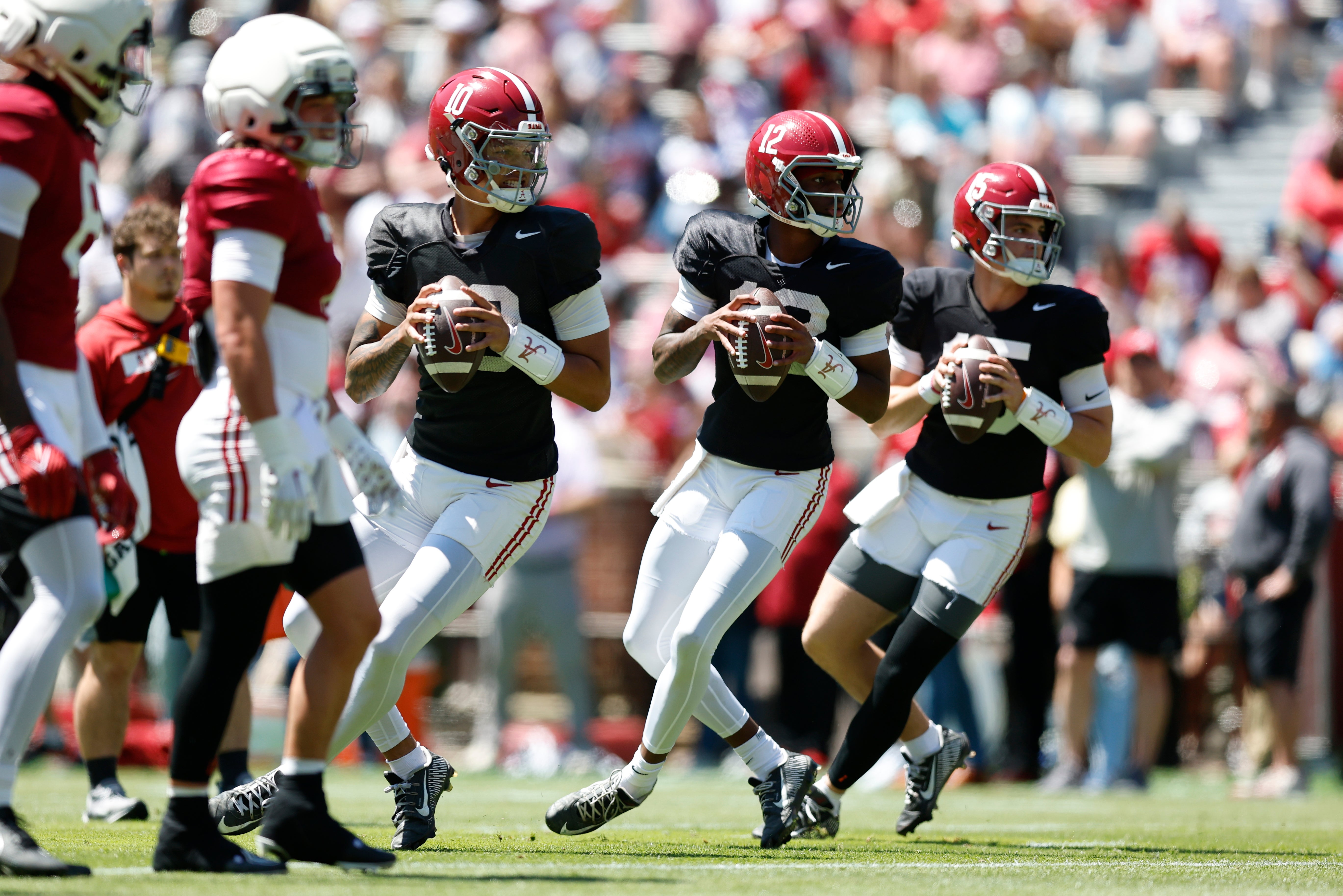 Alabama quarterbacks Ty Simpson, Keelon Russell and Austin Mack