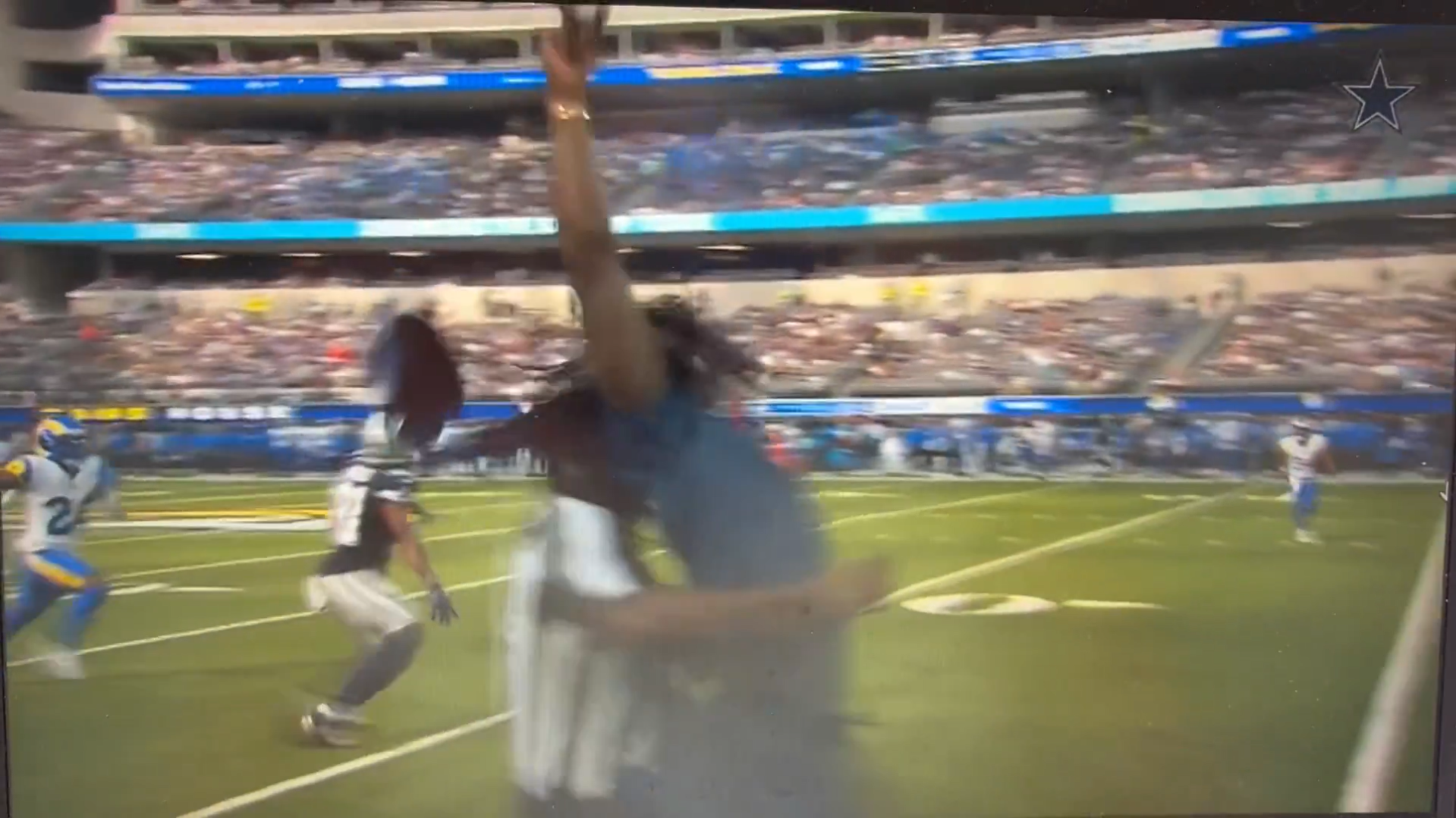 Dallas Cowboys WR CeeDee Lamb takes a hit by a ref while standing on the sideline during preseason opener.