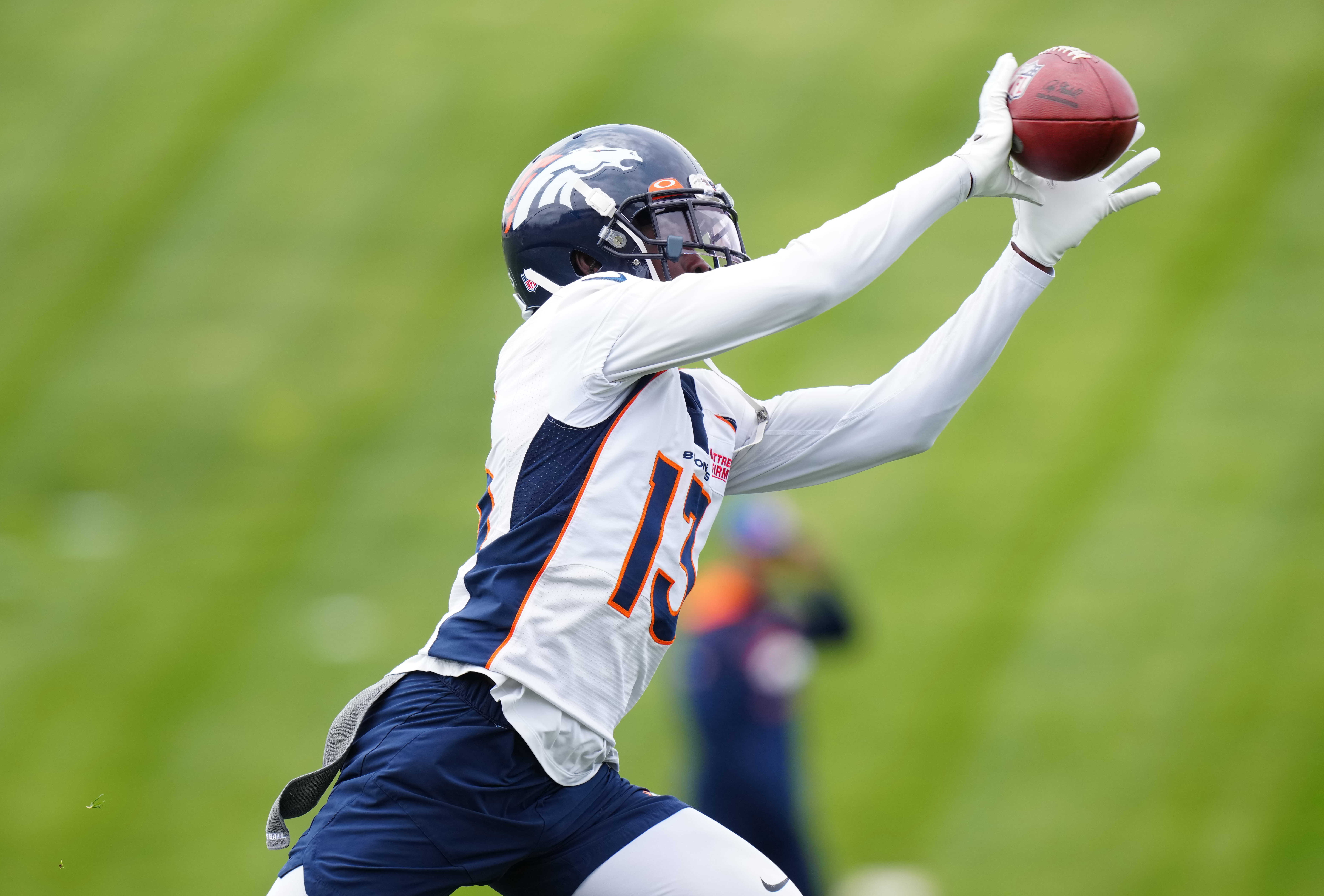 May 23, 2022; Englewood, CO, USA; Denver Broncos cornerback Michael Ojemudia (13) during OTA workouts at the UC Health Training Center.