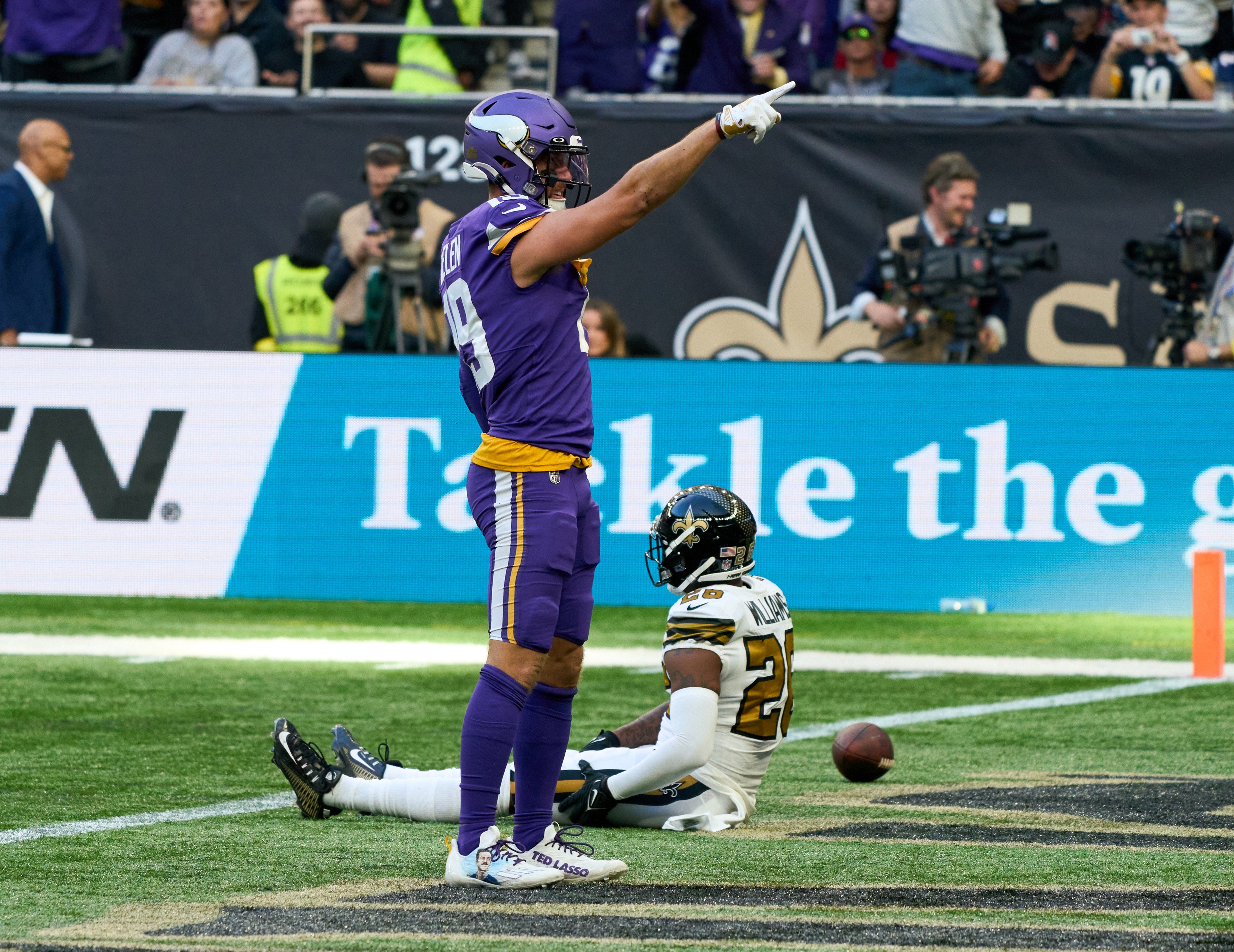 Oct 2, 2022; London, United Kingdom; Minnesota Vikings wide receiver Adam Thielen (19) reacts after he catches a pass under pressure from New Orleans Saints cornerback Paulson Adebo (29) during the second half of the NFL International Series game at Tottenham Hotspur Stadium.