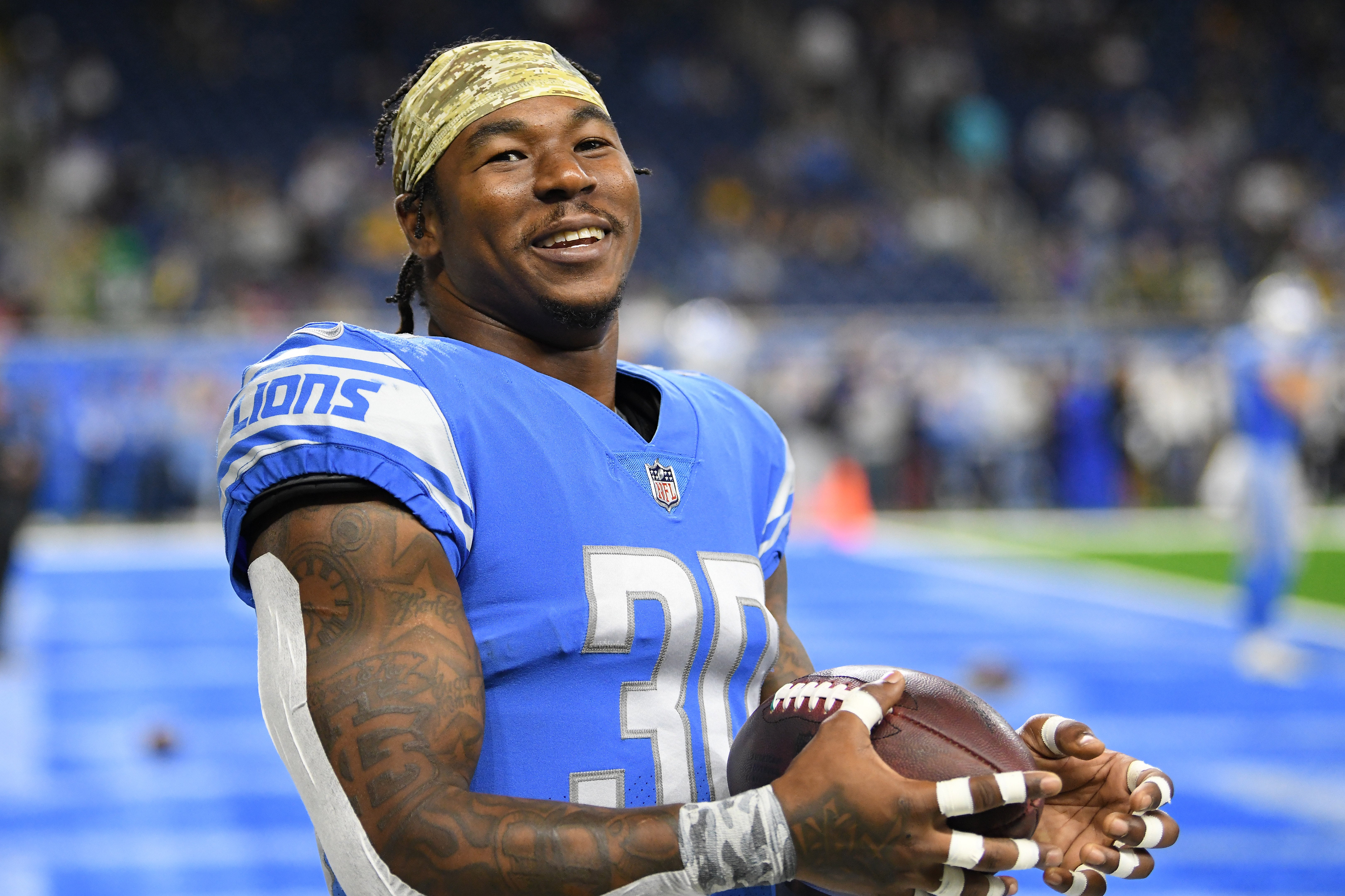 Nov 6, 2022; Detroit, Michigan, USA; Detroit Lions running back Jamaal Williams (30) plays catch with the fans during pre-game warmups before their game against the Green Bay Packers at Ford Field.