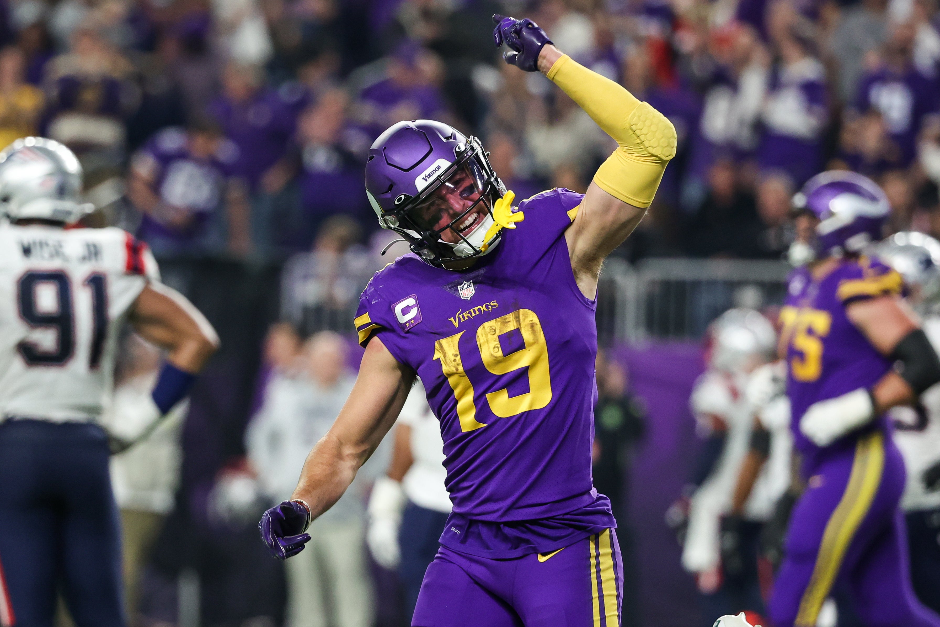 Nov 24, 2022; Minneapolis, Minnesota, USA; Minnesota Vikings wide receiver Adam Thielen (19) celebrates his touchdown against the New England Patriots during the fourth quarter at U.S. Bank Stadium.
