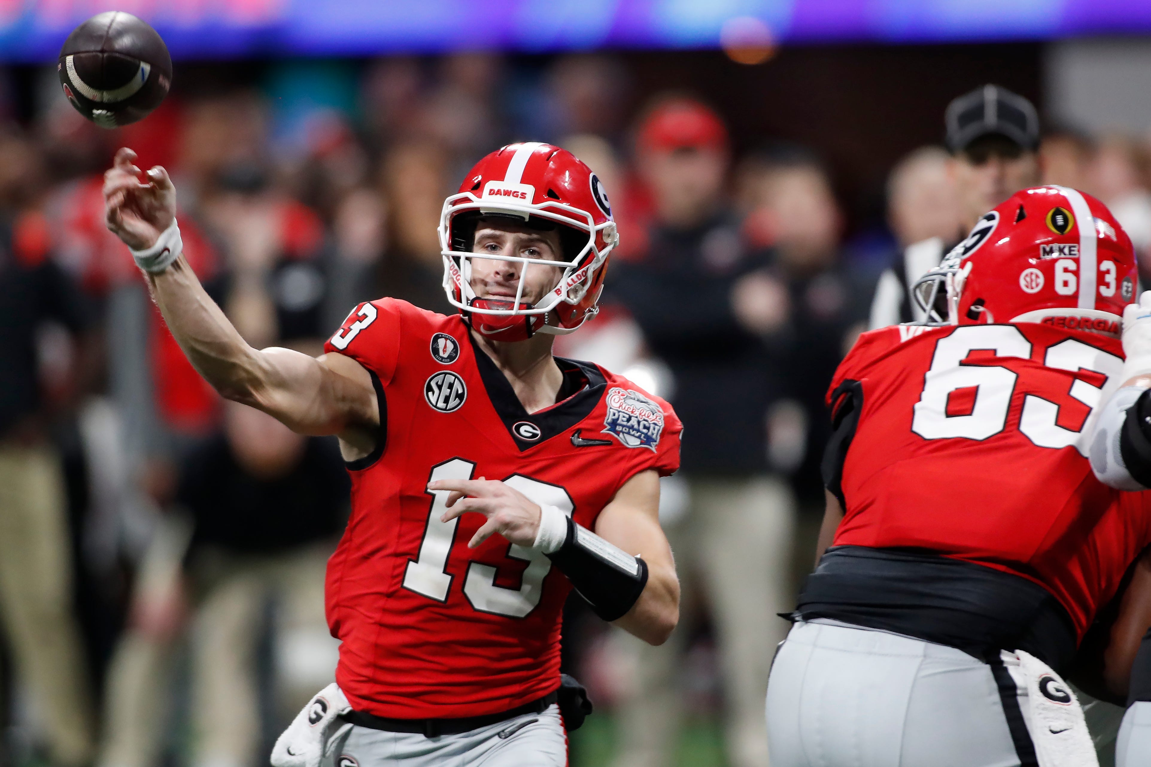 Georgia quarterback Stetson Bennett (13) throws a pass during the second half of the Chick-fil-A Peach Bowl NCAA College Football Playoff semifinal game between Ohio State and Georgia on Saturday, Dec... Joshua L. Jones-USA TODAY NETWORK
