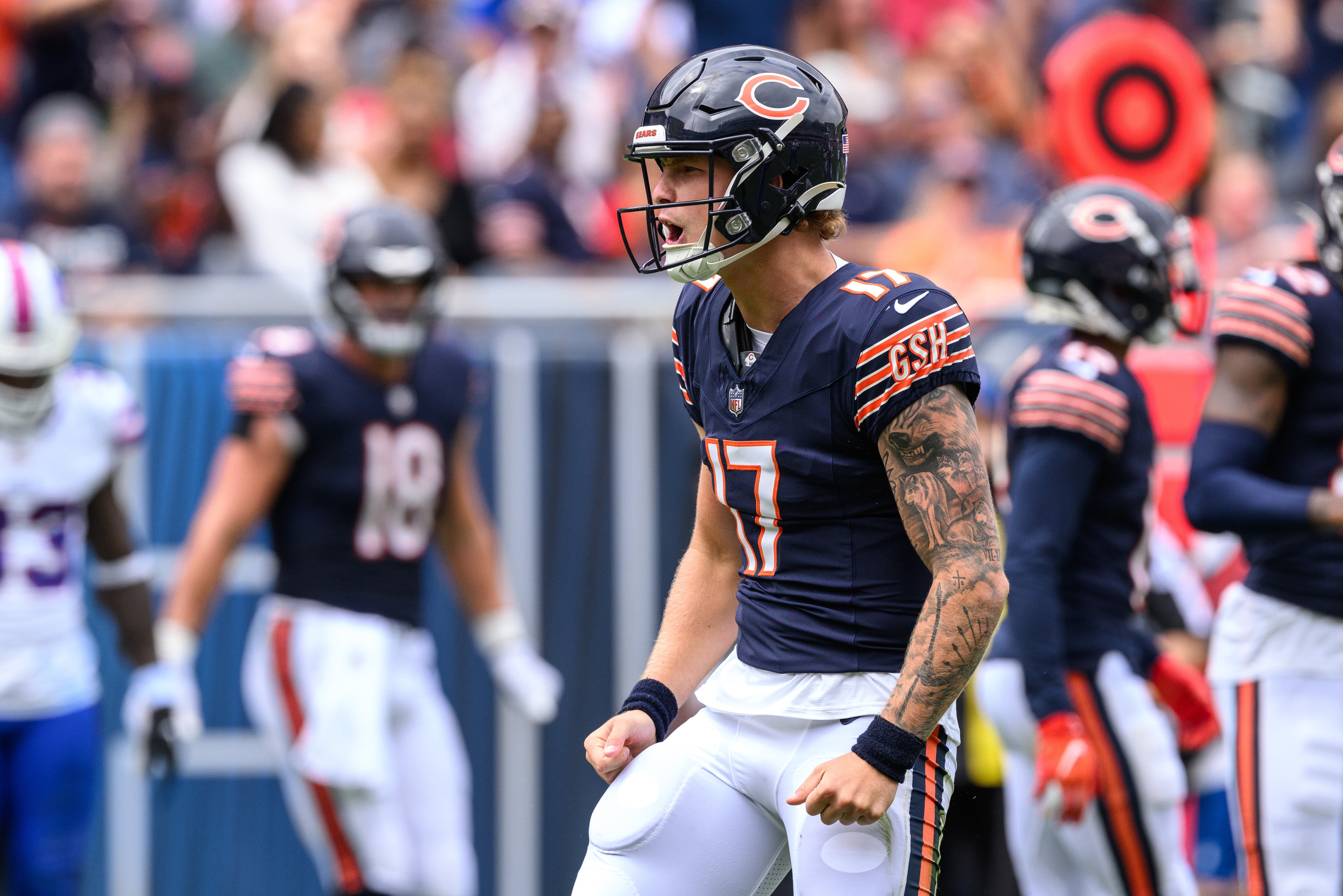 Aug 26, 2023; Chicago, Illinois, USA; Chicago Bears quarterback Tyson Bagent (17) celebrates after a run against the Buffalo Bills during the second quarter at Soldier Field.