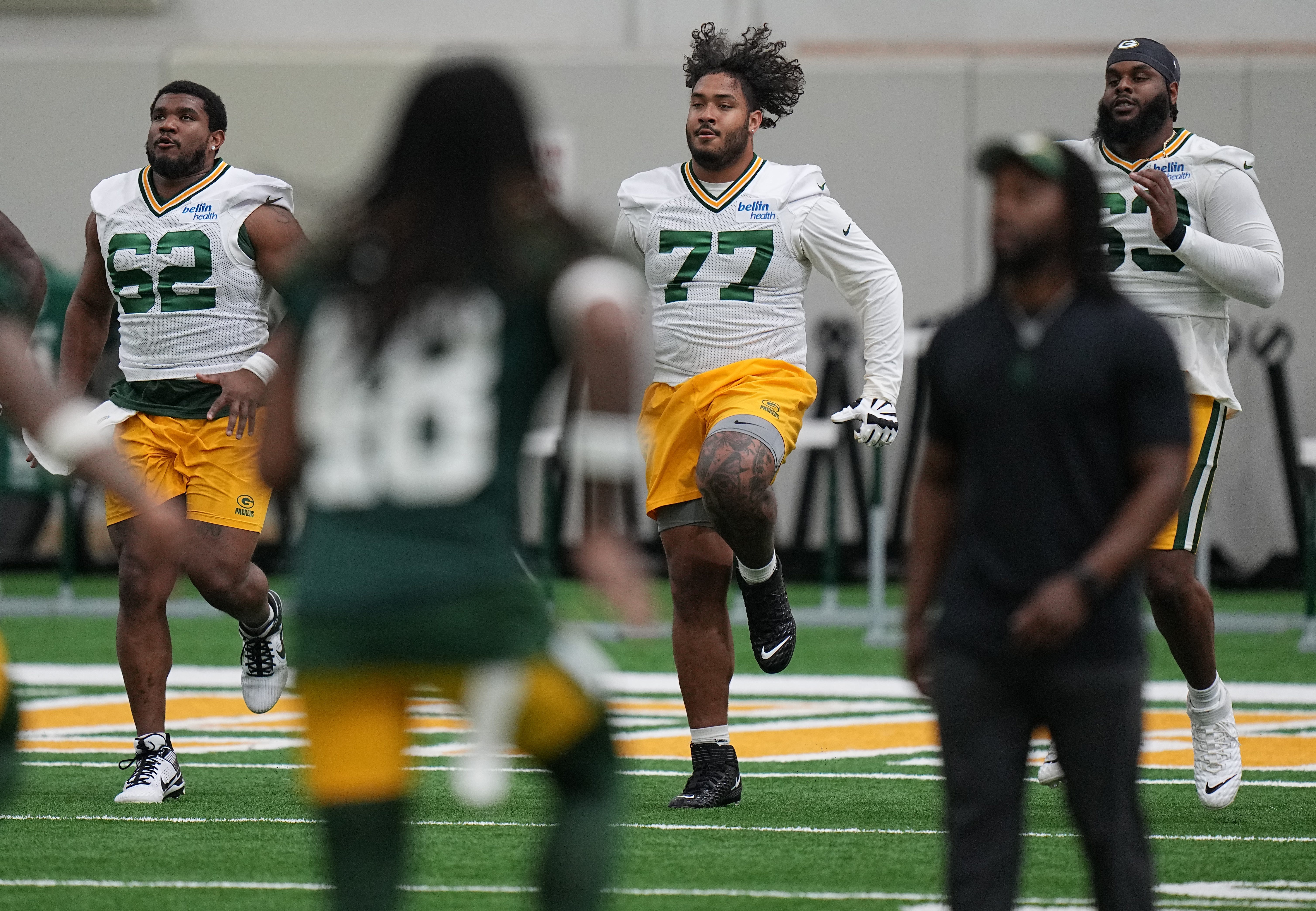 Offensive linemen Rasheed Walker (62), Jordan Morgan (77), and Rasheed Walker (63) are shown during organized team activities for the Green Bay Packers Tuesday, May 21, 2024 in Green Bay, Wisconsin.