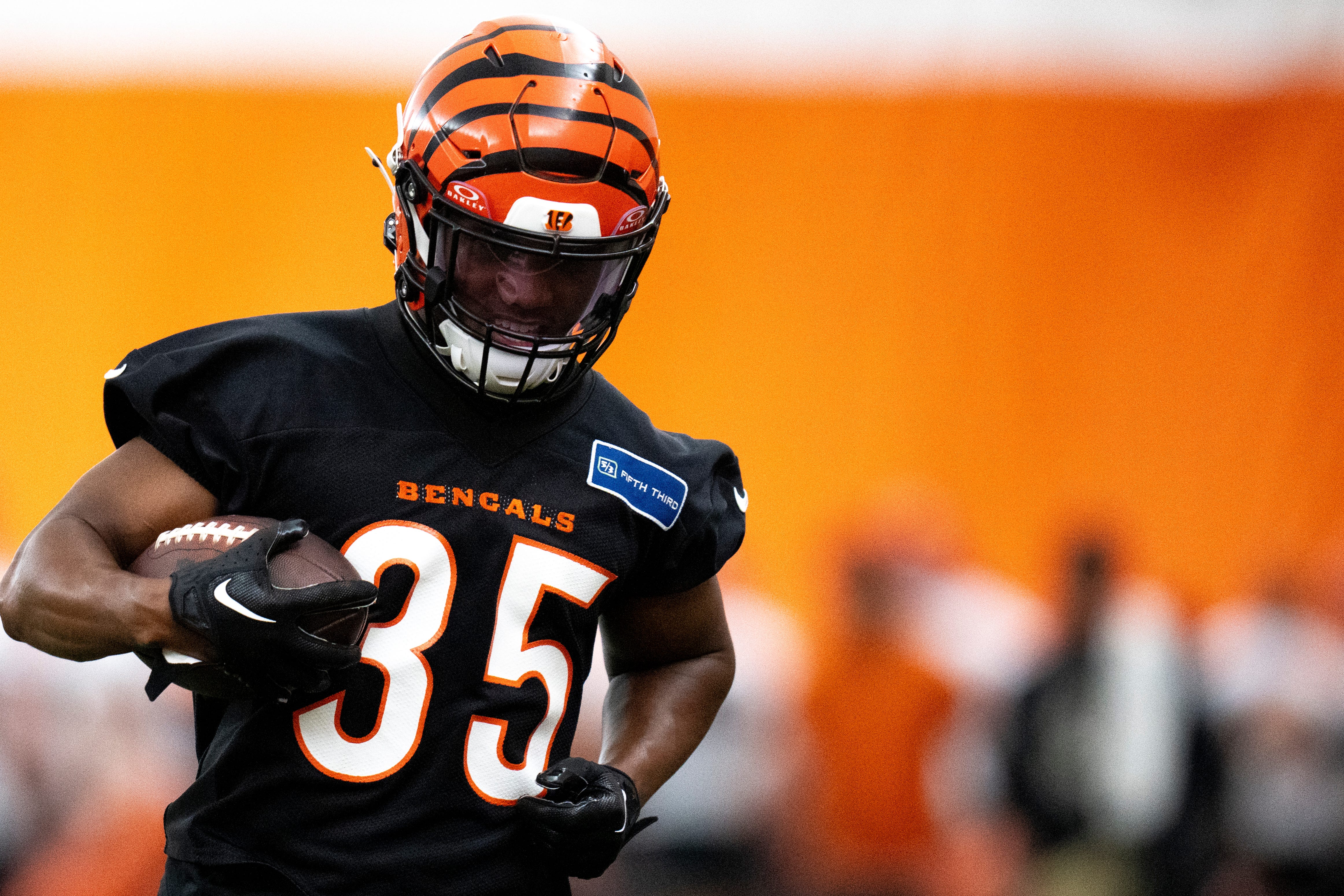 Cincinnati Bengals cornerback Jalen Davis (35) runs with the ball after catching a pass during an interception drill at Bengals spring practice at the IEL Indoor Facility in Cincinnati on Tuesday, June 11, 2024.