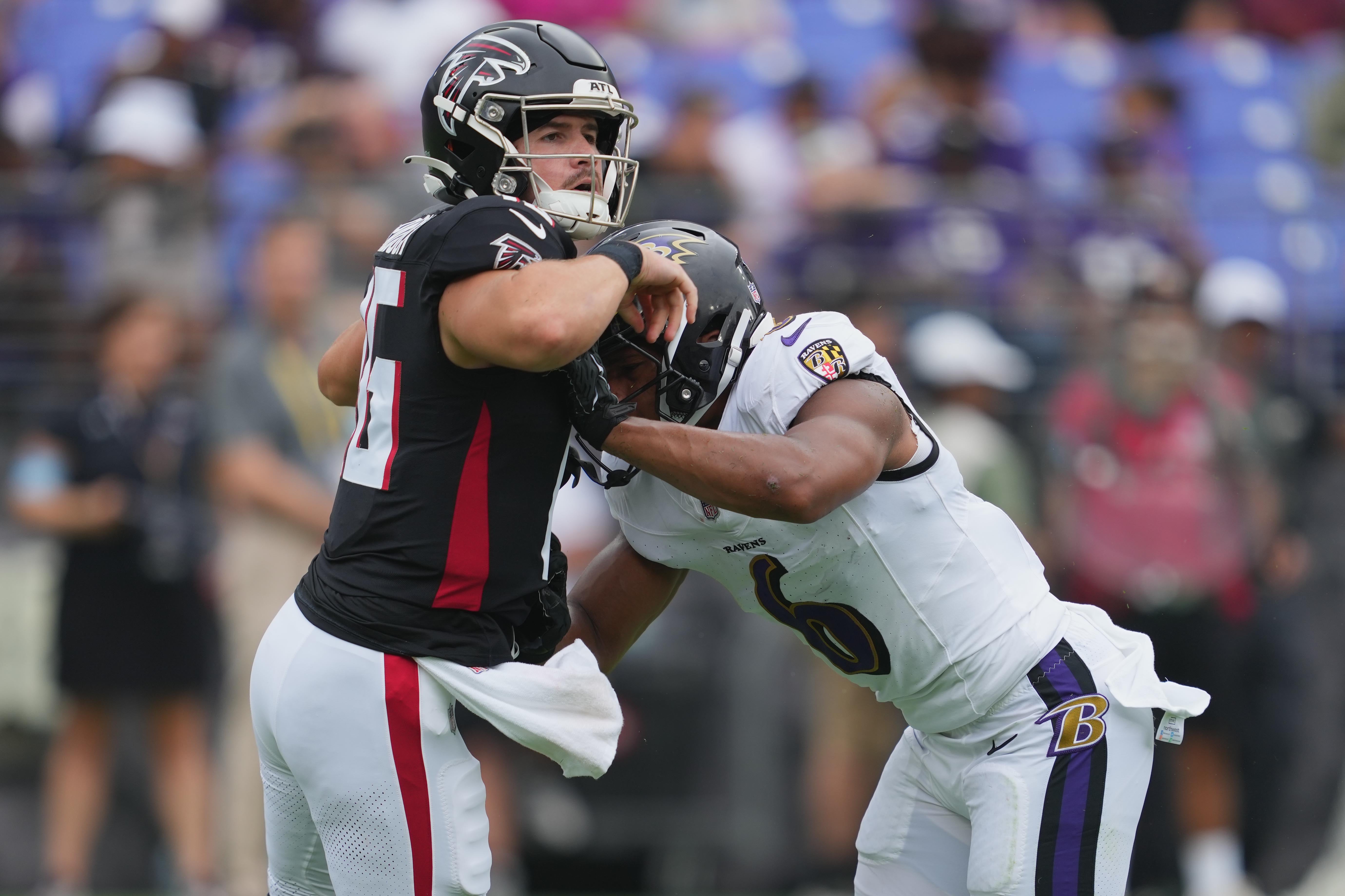 Aug 17, 2024; Baltimore, Maryland, USA; Atlanta Falcons quarterback John Paddock (16) is pressured during the fourth quarter by Baltimore Ravens safety Beau Brade (6) at M&T Bank Stadium.
