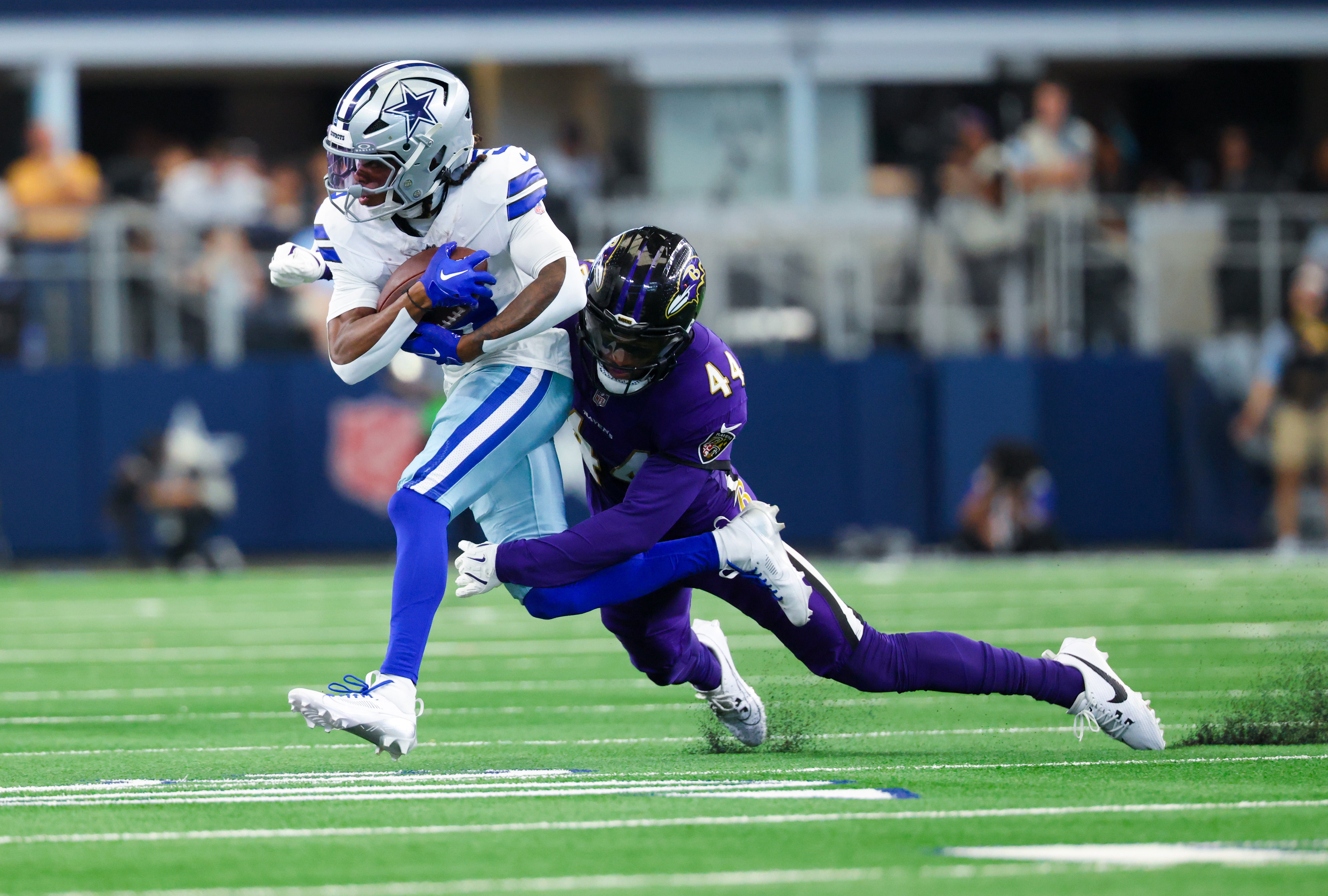 Dallas Cowboys wide receiver KaVontae Turpin (9) is tackled by Baltimore Ravens cornerback Marlon Humphrey (44) during the first half at AT&T Stadium.