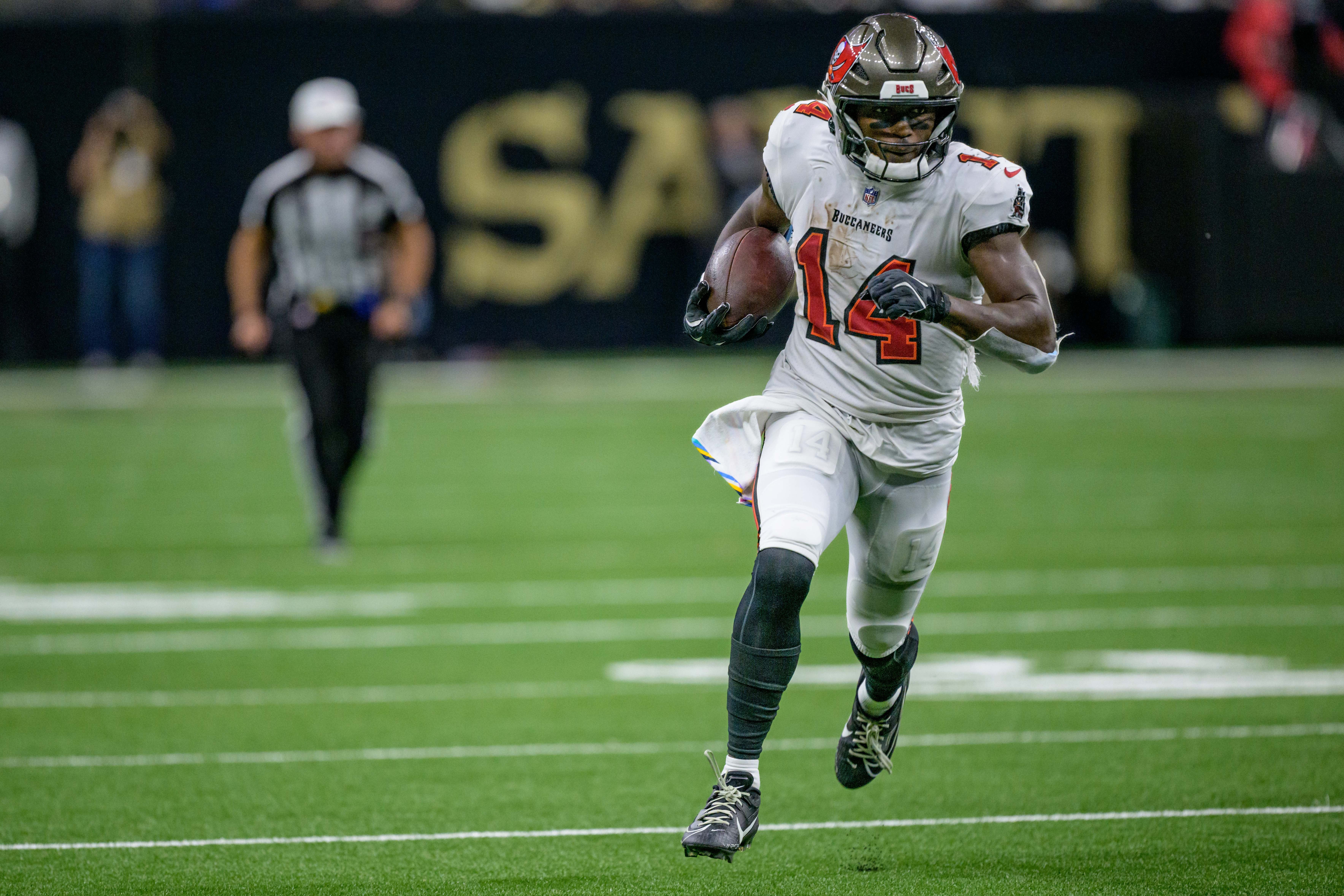 Oct 13, 2024; New Orleans, Louisiana, USA; Tampa Bay Buccaneers wide receiver Chris Godwin (14) runs in for a touchdown during the third quarter against the New Orleans Saints at Caesars Superdome.